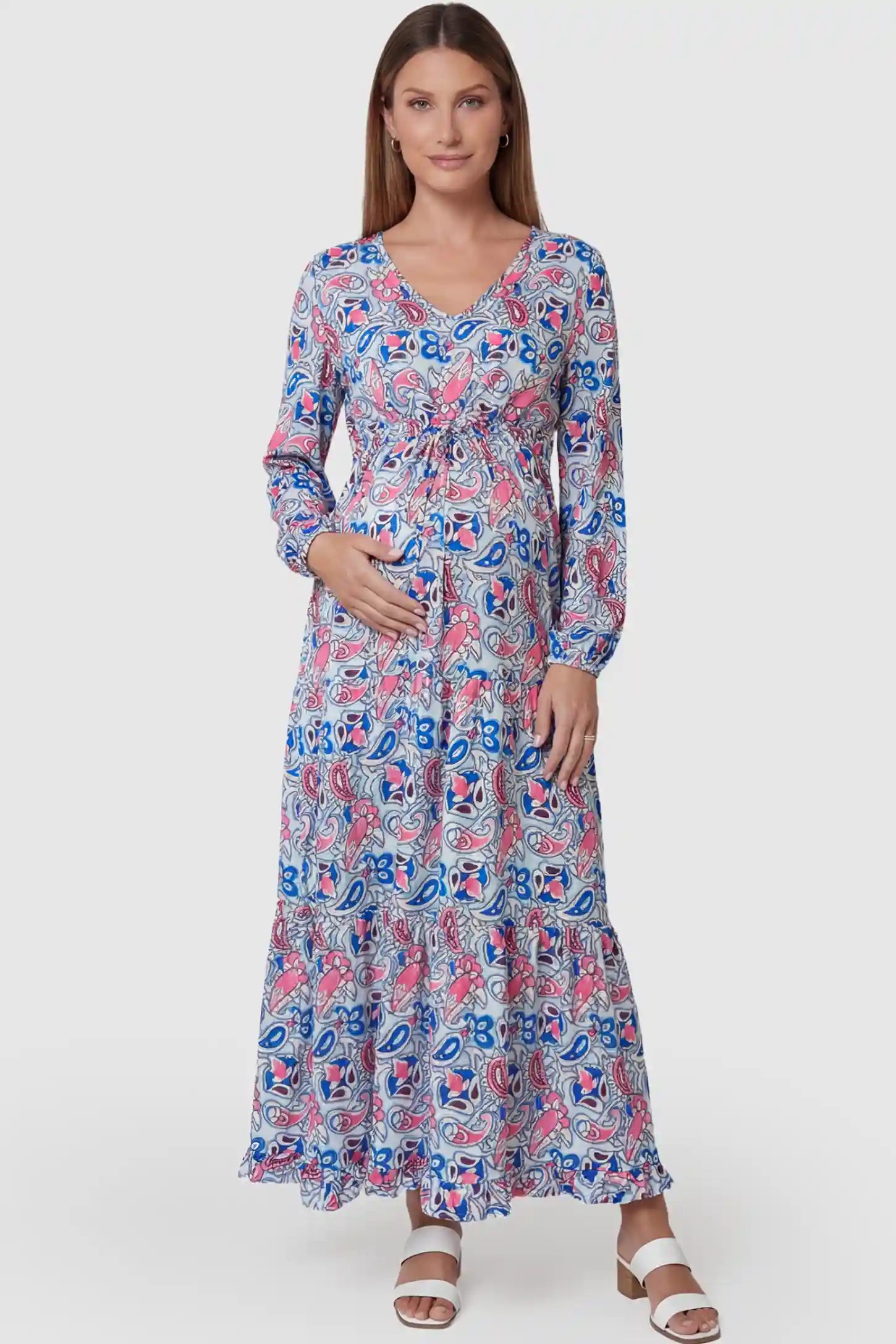 Paisley Print V-Neck Tiered Maternity Maxi Dress Paisley Print V-Neck Tiered Maternity Maxi Dress in peach red paisley pattern featuring empire waist and flowy tiered skirt on pregnant model.