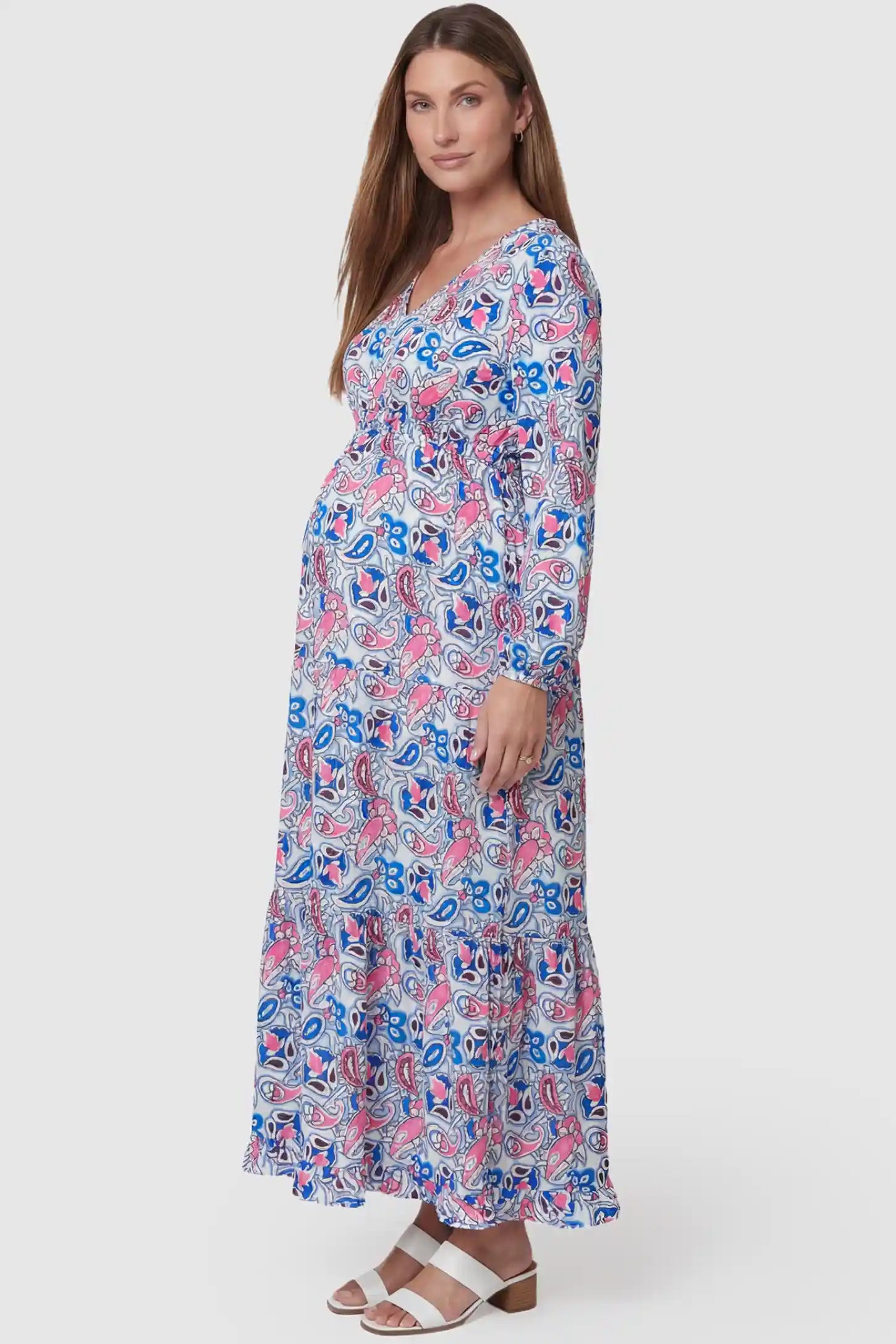 Paisley Print V-Neck Tiered Maternity Maxi Dress Paisley Print V-Neck Tiered Maternity Maxi Dress in peach red paisley pattern featuring empire waist and flowy tiered skirt on pregnant model.