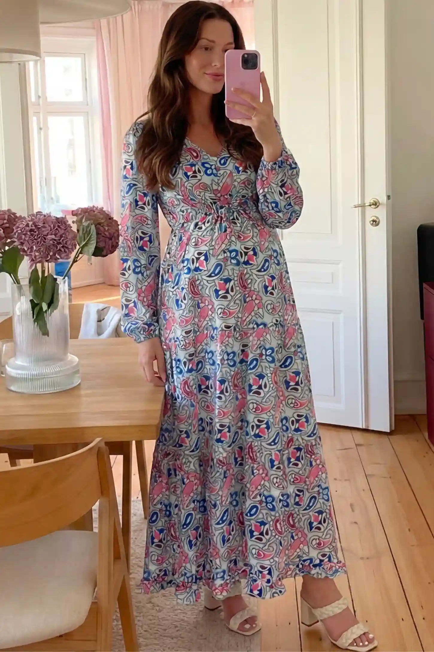 Paisley Print V-Neck Tiered Maternity Maxi Dress Paisley Print V-Neck Tiered Maternity Maxi Dress in peach red paisley pattern featuring empire waist and flowy tiered skirt on pregnant model.