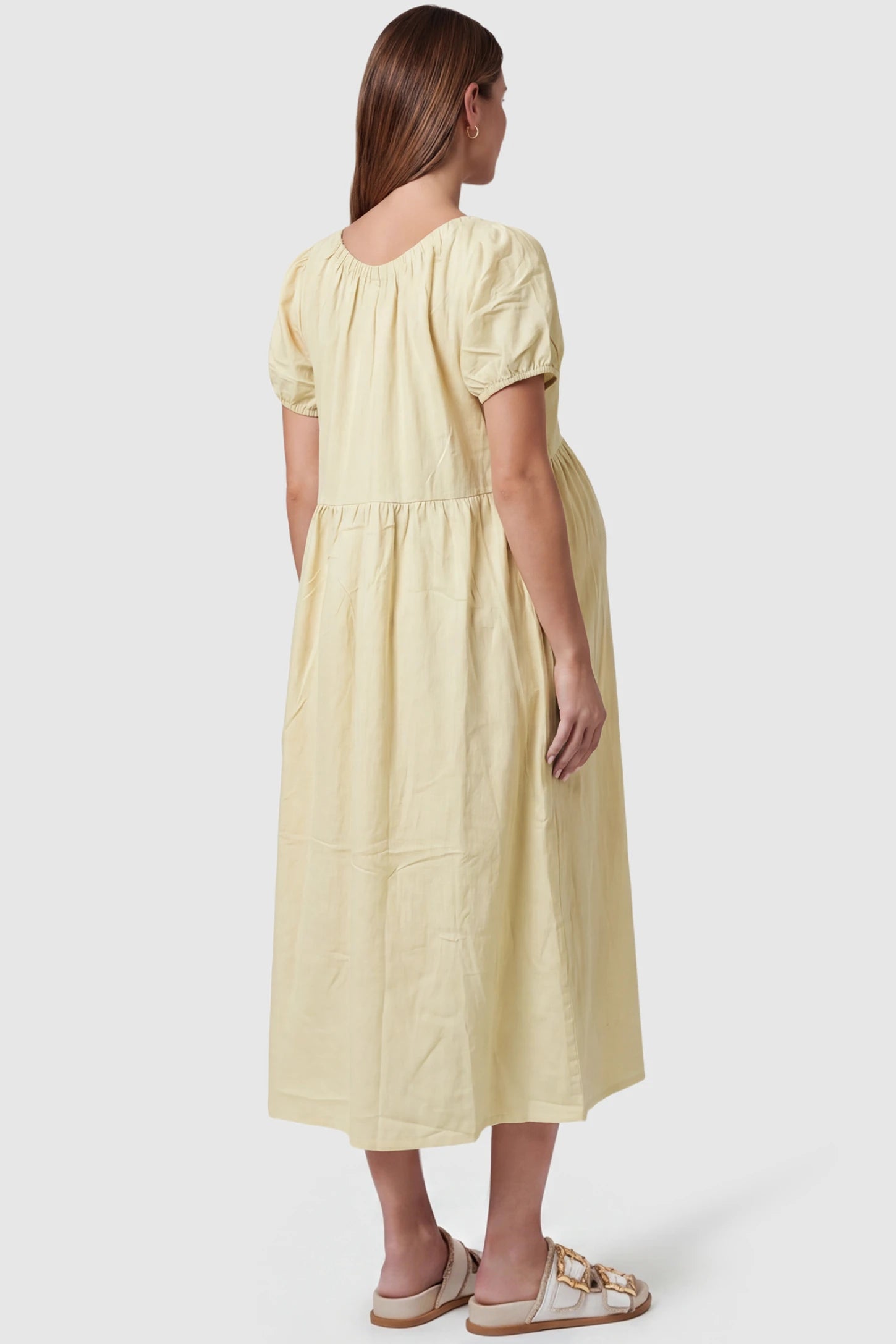 V-Neck Short Sleeve Maternity Midi Dress with Pockets V-neck short sleeve maternity midi dress with pockets in yellow with short sleeves, back view on pregnant model