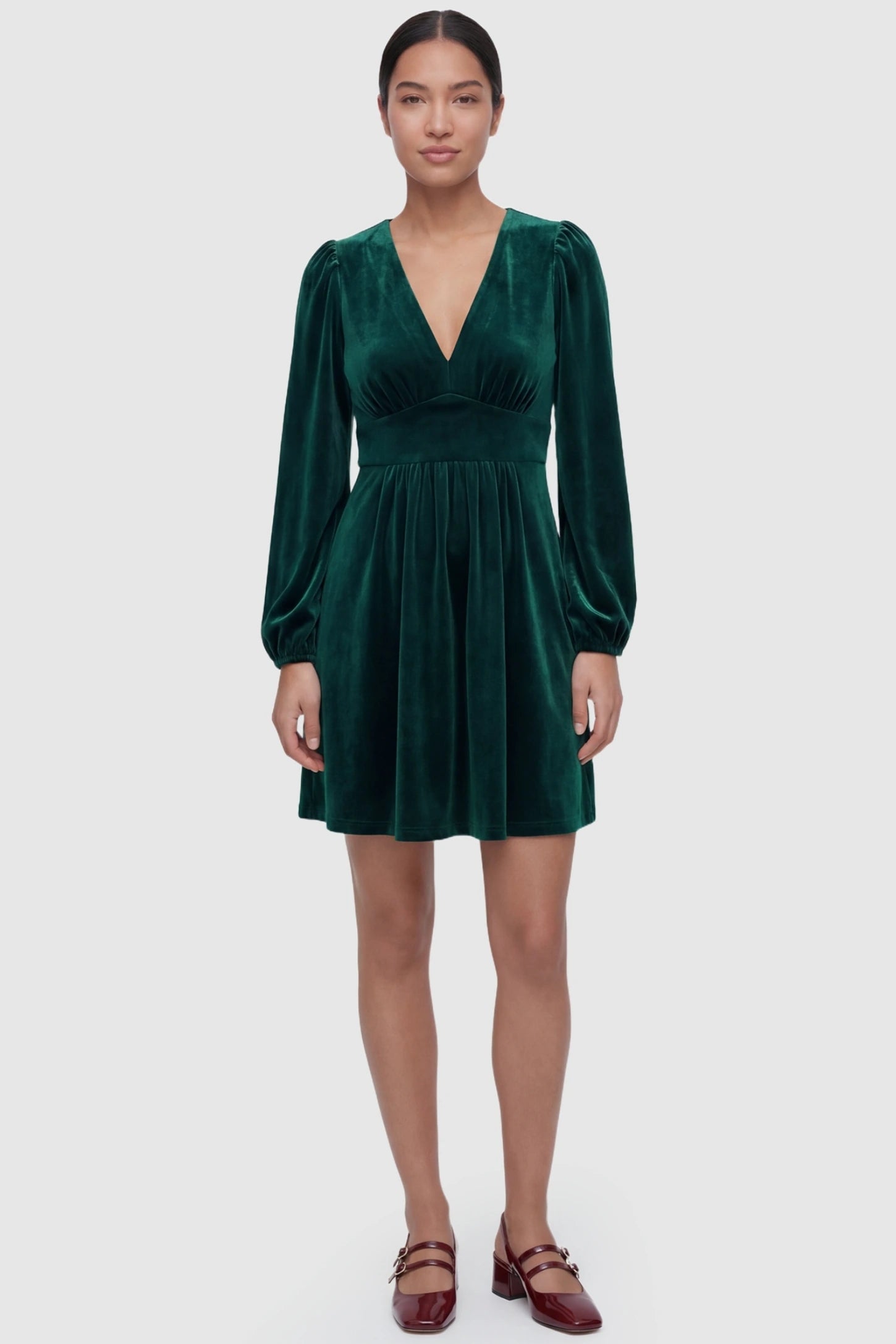 Velvet Ruched A-Line Maternity Mini Dress Velvet Ruched A-Line Maternity Mini Dress in Dark Green featuring a flattering A-line silhouette on a postpartum model, front view.