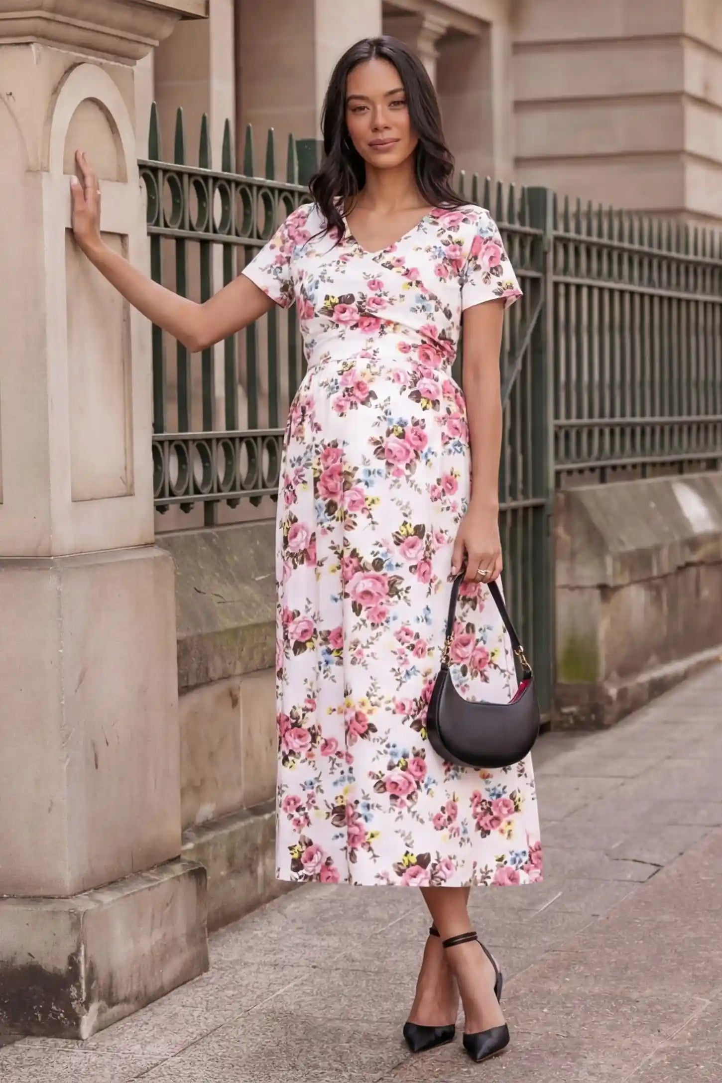 Discreet Nursing Opening Floral Tie-Waist Maternity & Nursing Maxi Dress in Pink Floral featuring a functional wrap-style V-neck on a pregnant model outdoors.