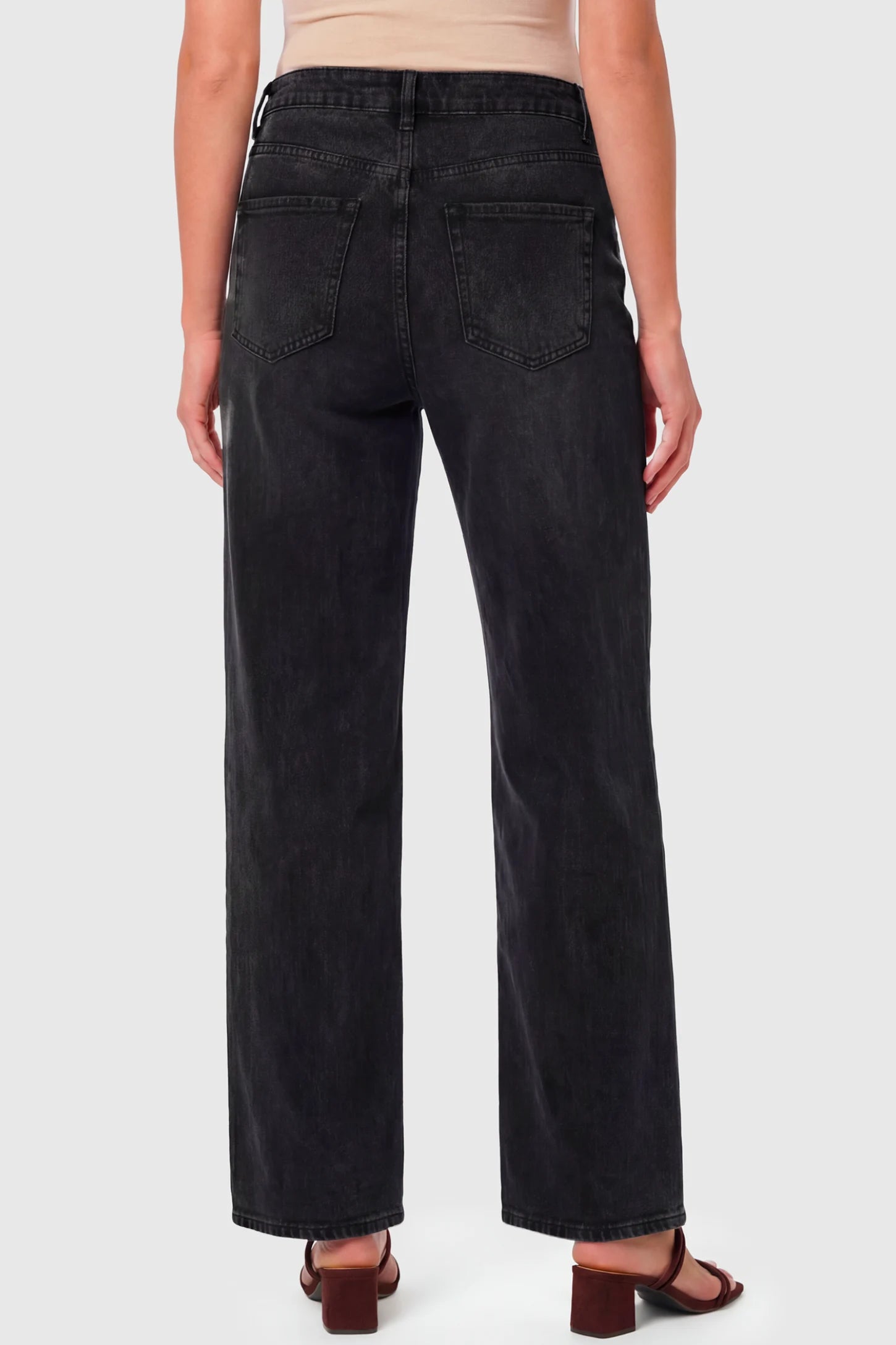 High-Rise Wide Leg Maternity Jeans High-Rise Wide Leg Maternity Jeans in black featuring wide-leg silhouette on a pregnant model.