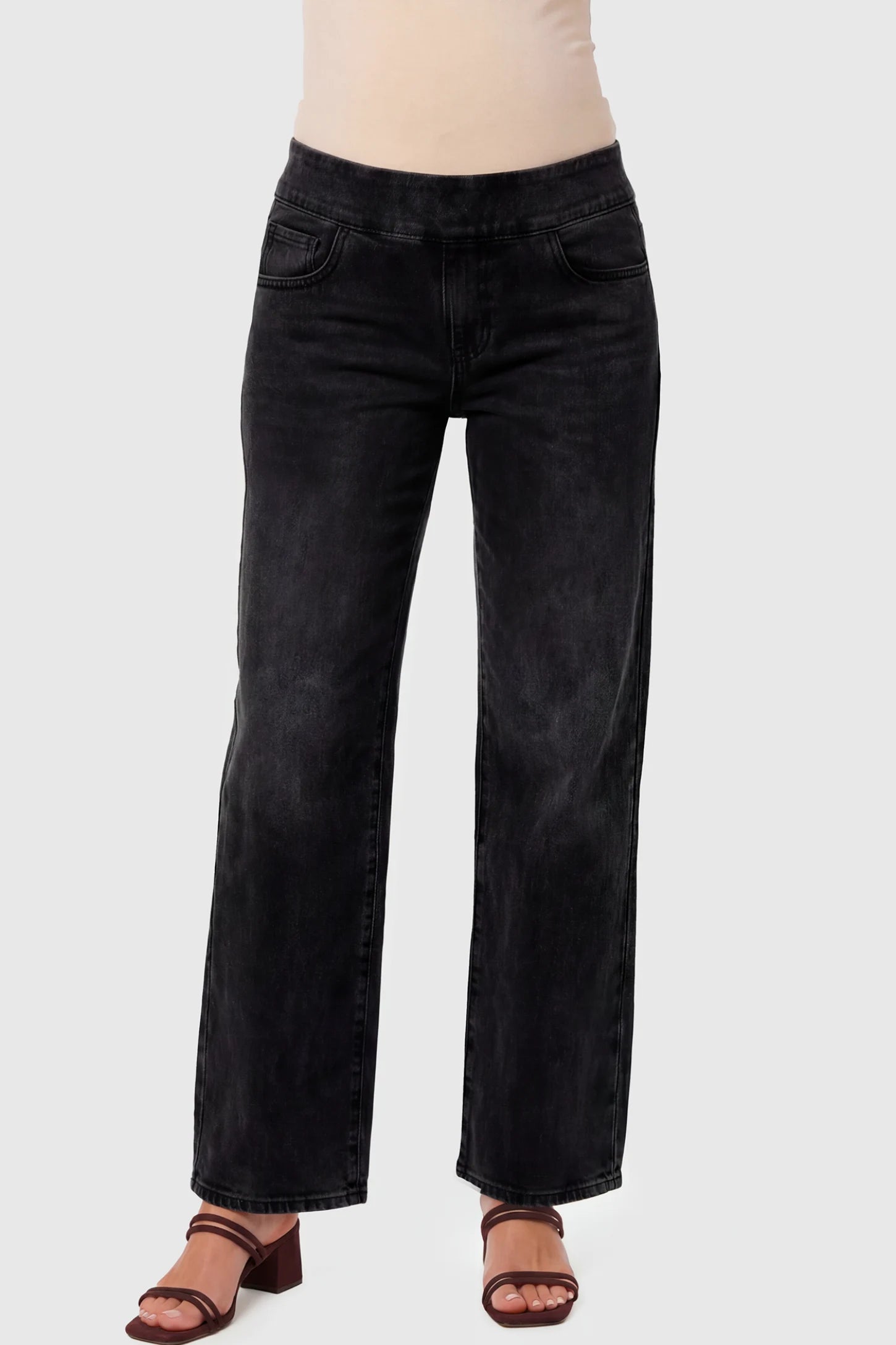 High-Rise Wide Leg Maternity Jeans High-Rise Wide Leg Maternity Jeans in black featuring over-the-belly support and wide-leg silhouette on a pregnant model.