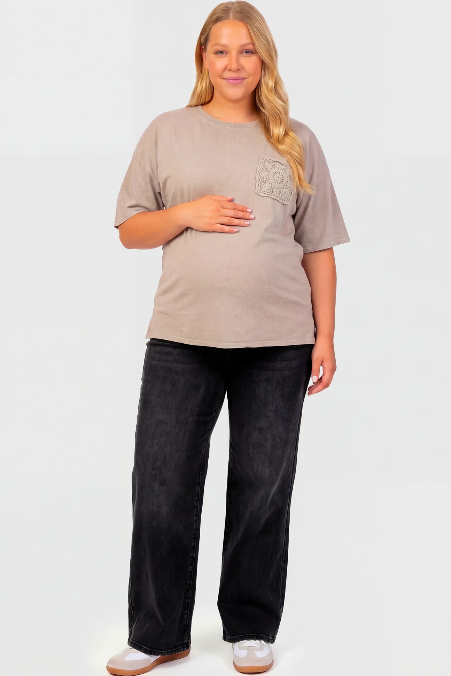 High-Rise Wide Leg Maternity Jeans High-Rise Wide Leg Maternity Jeans in black featuring over-the-belly support and wide-leg silhouette on a plus size pregnant model.