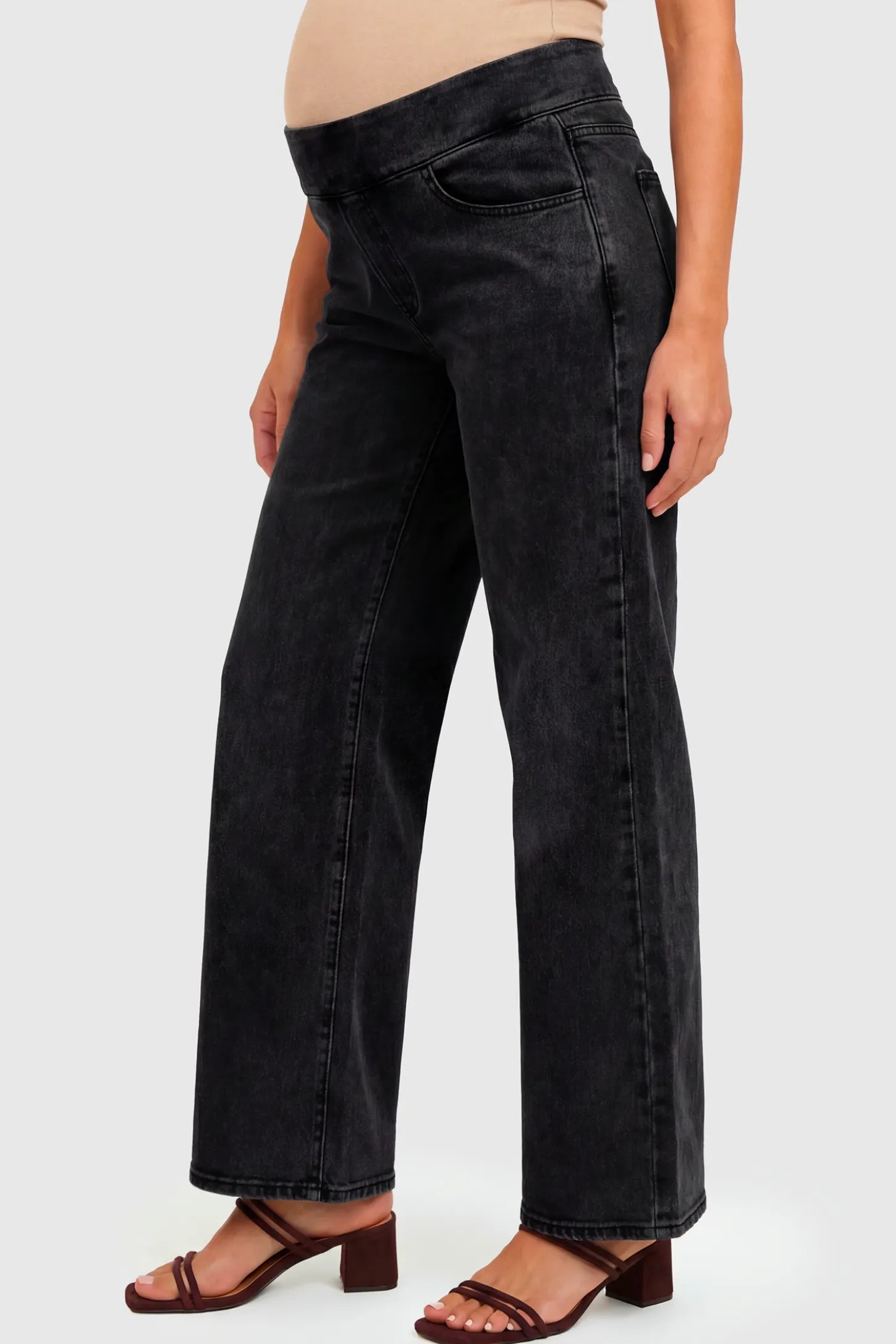 High-Rise Wide Leg Maternity Jeans High-Rise Wide Leg Maternity Jeans in black featuring over-the-belly support and wide-leg silhouette on a pregnant model.
