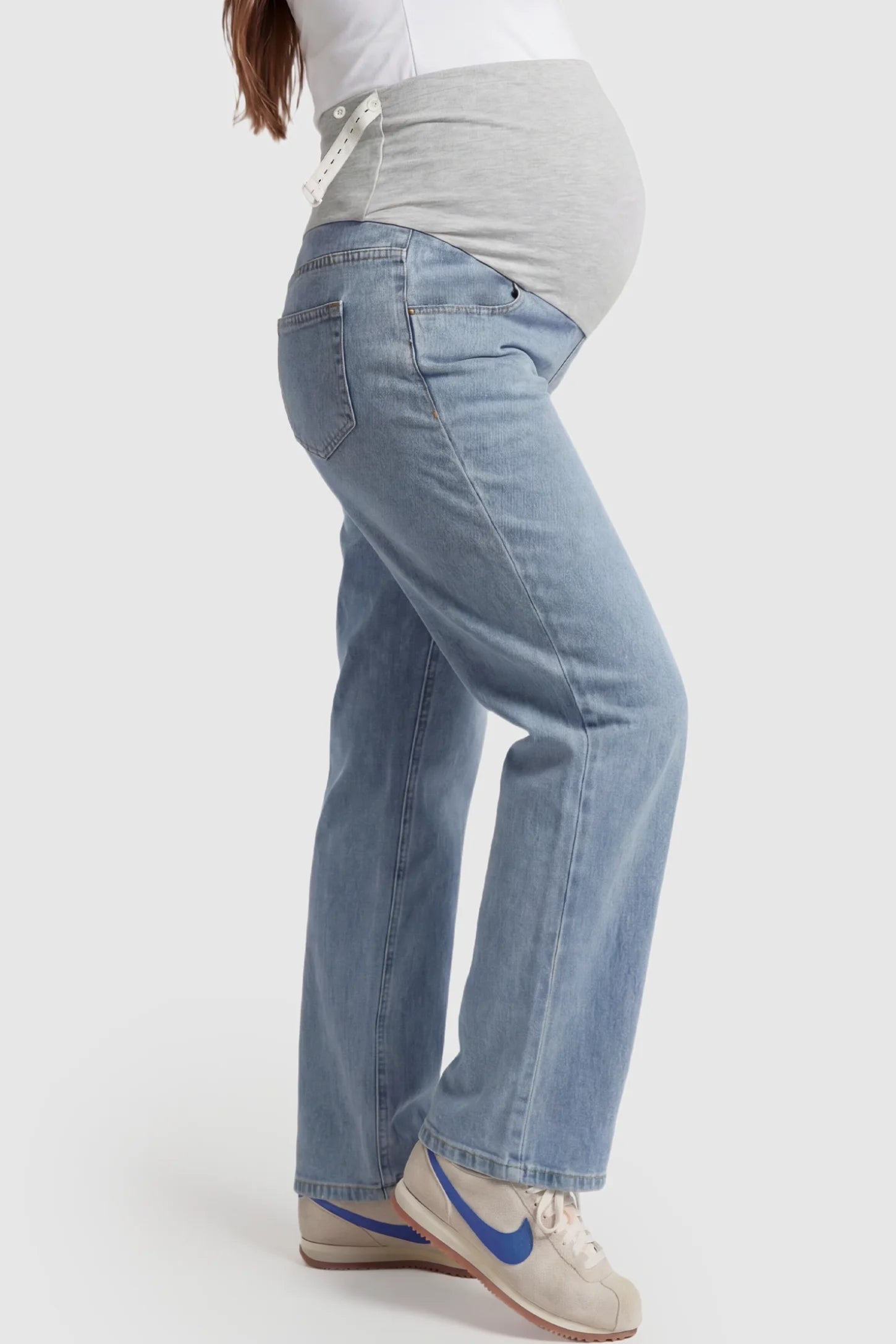 Denim Wide-Leg Maternity Jeans Denim straight-leg maternity jeans in light  blue wash featuring full belly panel support and relaxed fit on pregnant model.