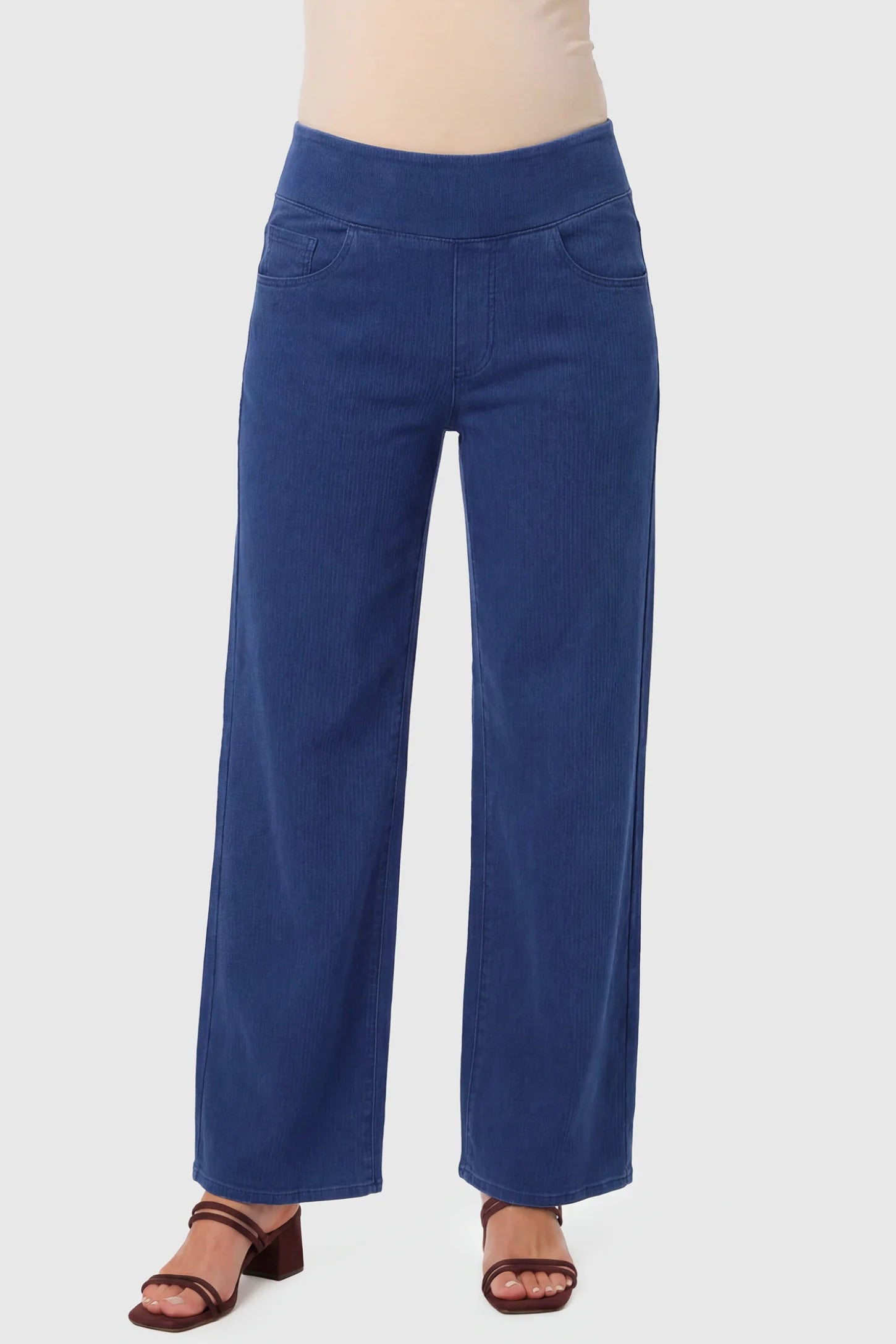 High-Rise Wide Leg Maternity Jeans High-Rise Wide Leg Maternity Jeans in dark blue featuring over-the-belly support and wide-leg silhouette on a pregnant model.