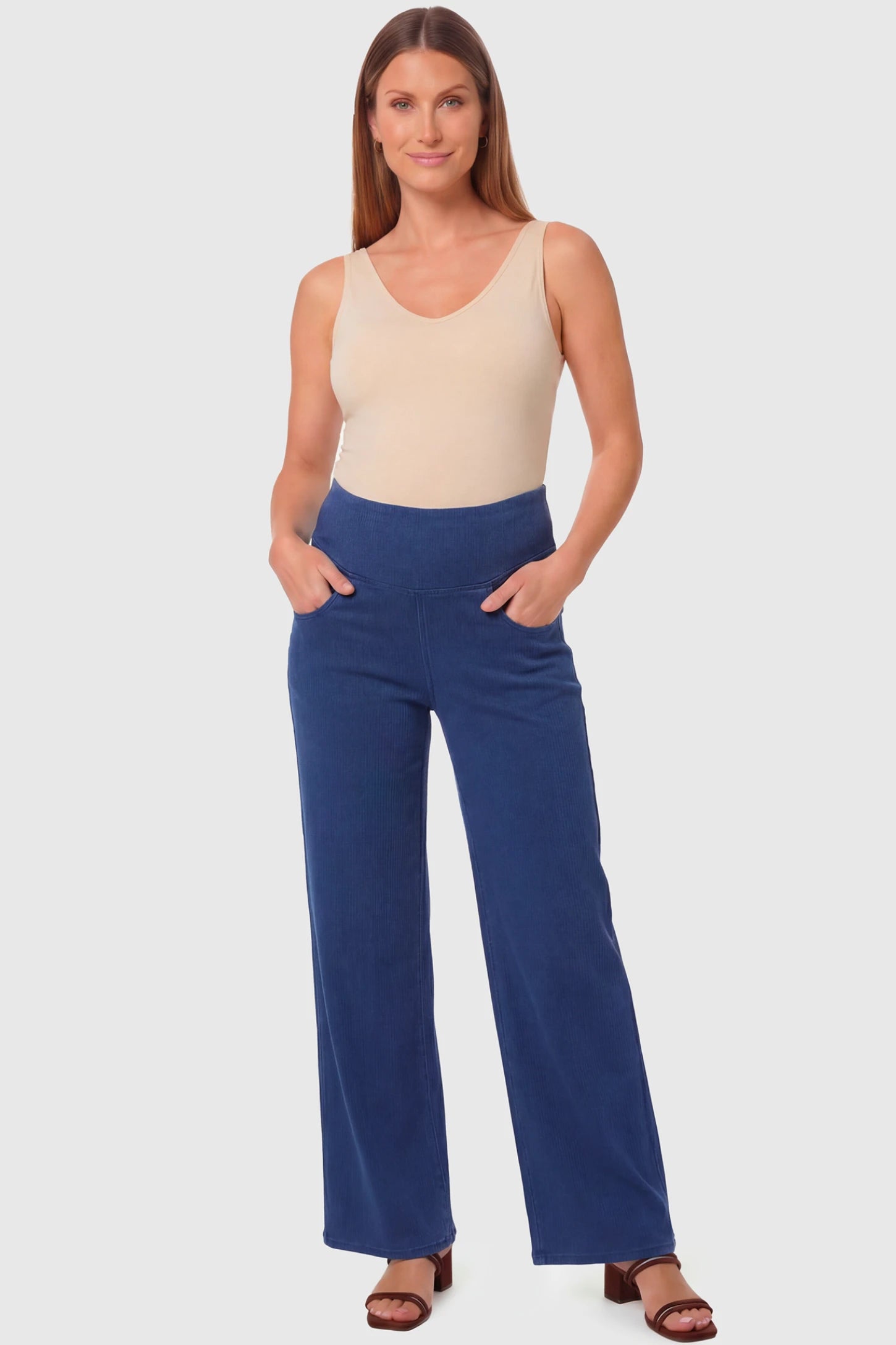 High-Rise Wide Leg Maternity Jeans High-Rise Wide Leg Maternity Jeans in dark blue featuring over-the-belly support and wide-leg silhouette on a pregnant model.