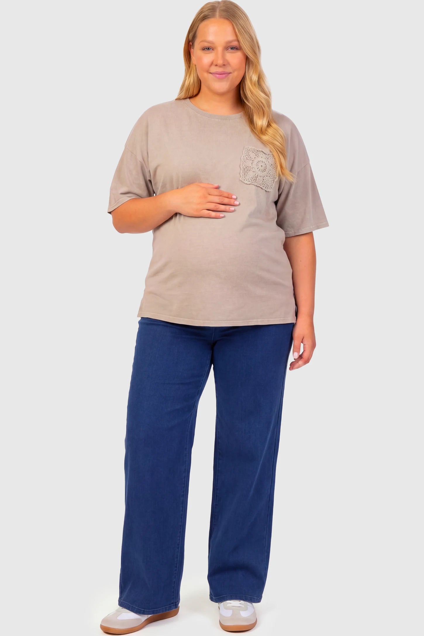High-Rise Wide Leg Maternity Jeans High-Rise Wide Leg Maternity Jeans in dark blue featuring over-the-belly support and wide-leg silhouette on a plus size pregnant model.