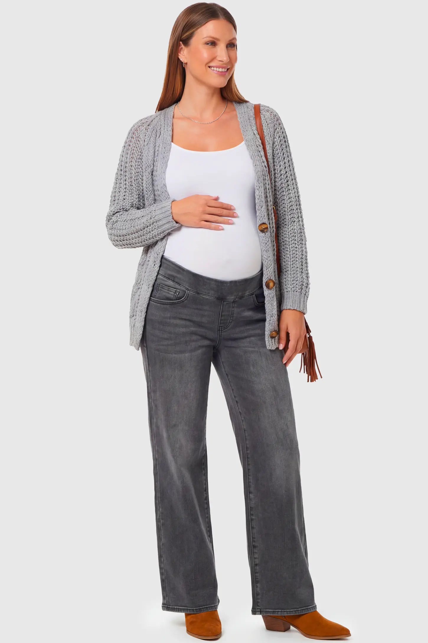 High-Rise Wide Leg Maternity Jeans High-Rise Wide Leg Maternity Jeans in gray featuring over-the-belly support and wide-leg silhouette on a pregnant model.