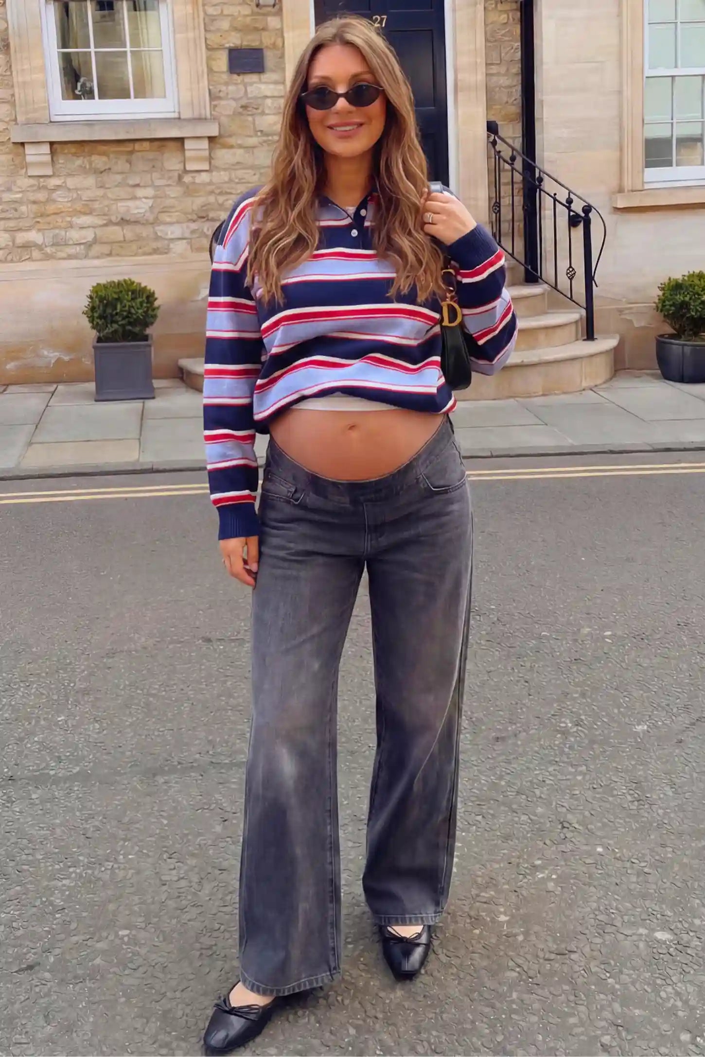 High-Rise Wide Leg Maternity Jeans High-Rise Wide Leg Maternity Jeans in gray featuring over-the-belly support and wide-leg silhouette on a pregnant model.