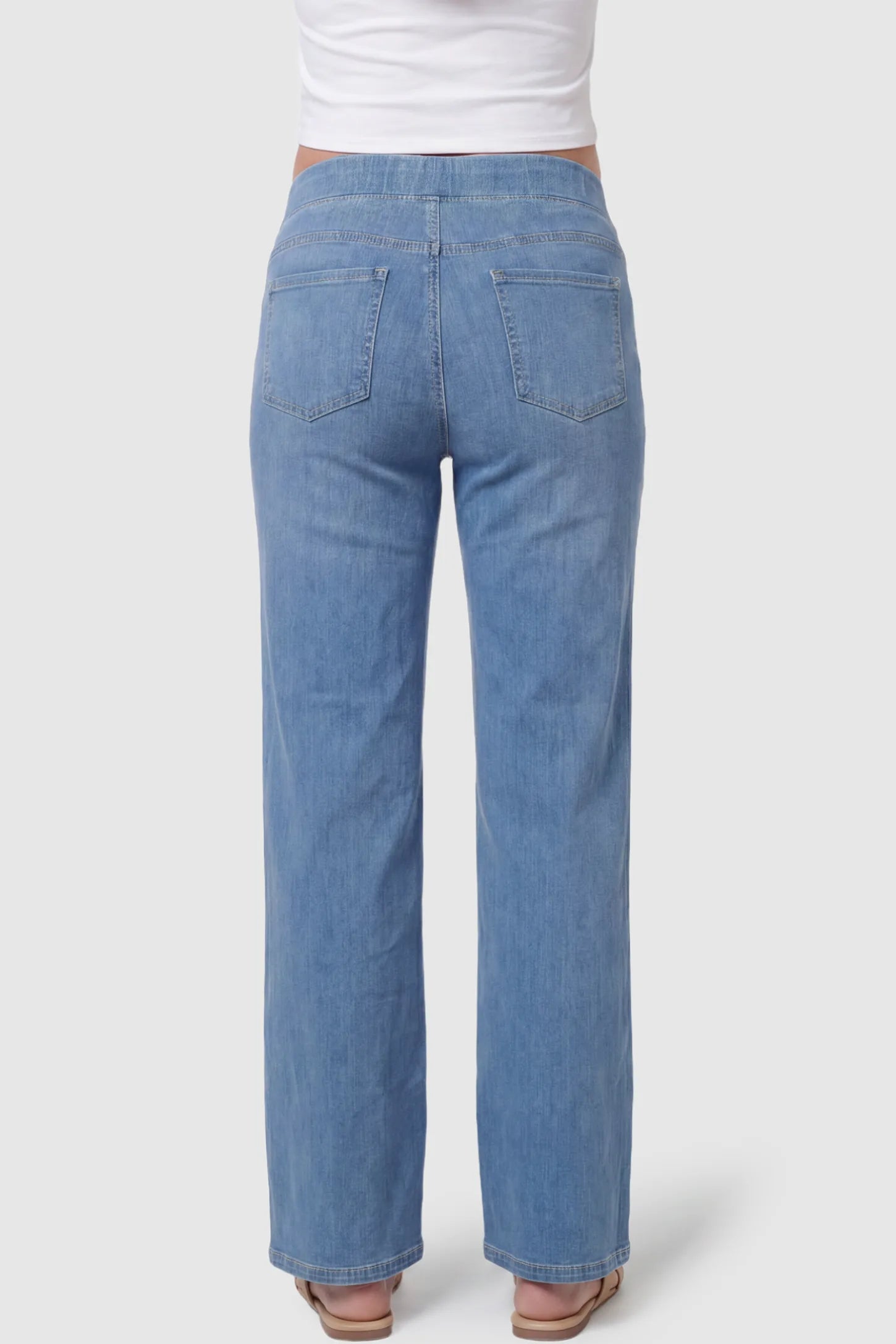 High-Rise Wide Leg Maternity Jeans High-Rise Wide Leg Maternity Jeans in light blue featuring over-the-belly support and wide-leg silhouette on a pregnant model, back view.