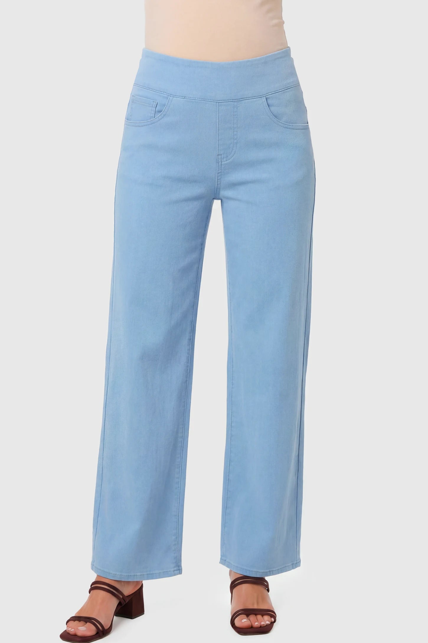 High-Rise Wide Leg Maternity Jeans in light blue  featuring over-the-belly support and wide-leg silhouette on a pregnant model.