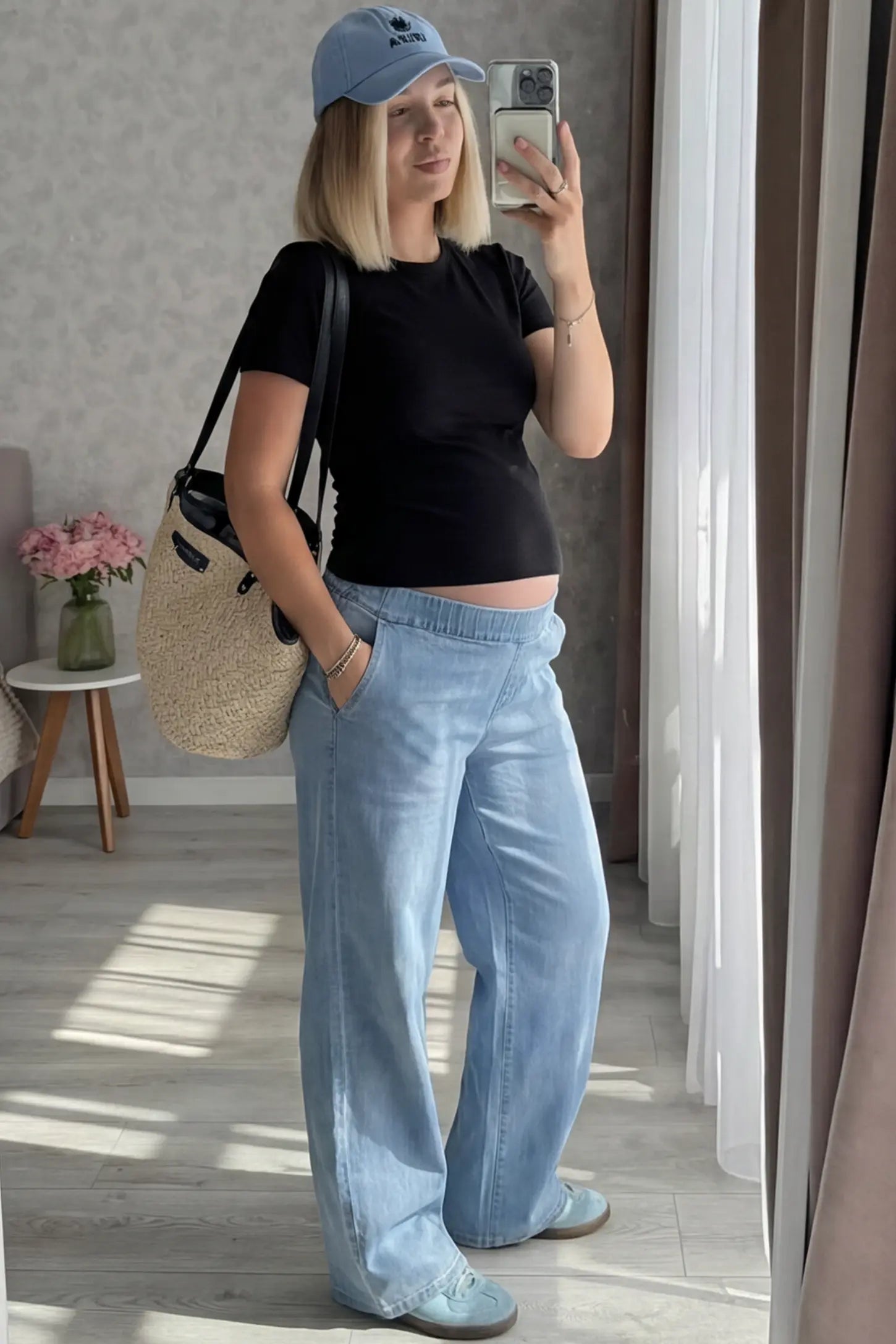 High-Rise Wide Leg Maternity Jeans High-Rise Wide Leg Maternity Jeans in light blue featuring over-the-belly support and wide-leg silhouette on a pregnant model in indoor setting, front view.
