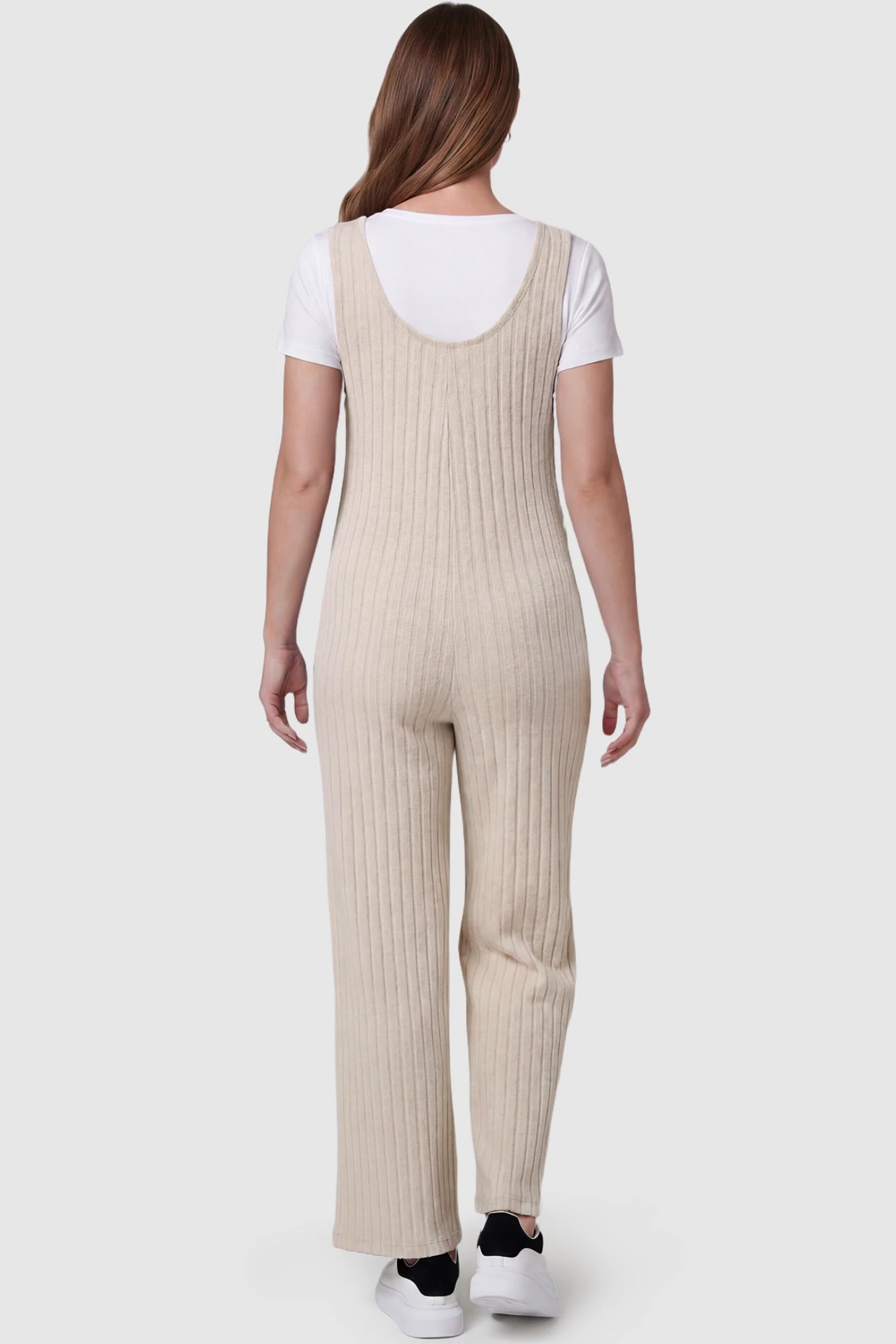 Ribbed Sleeveless Wide-Leg Maternity Jumpsuit Ribbed sleeveless wide-leg maternity jumpsuit in apricot with sleeveless ribbed design, back view on pregnant model