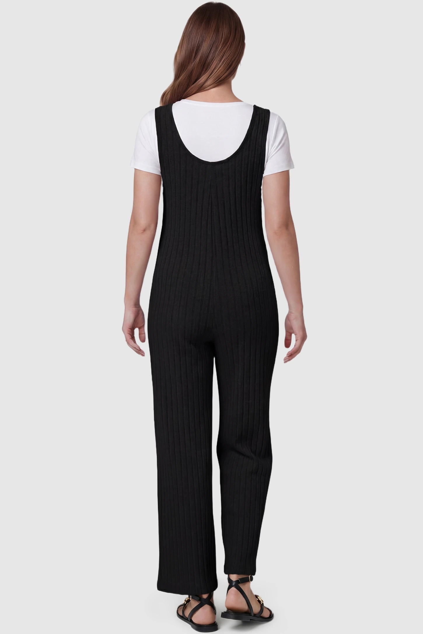 Ribbed Sleeveless Wide-Leg Maternity Jumpsuit Ribbed sleeveless wide-leg maternity jumpsuit in black with sleeveless ribbed design, back view on pregnant model