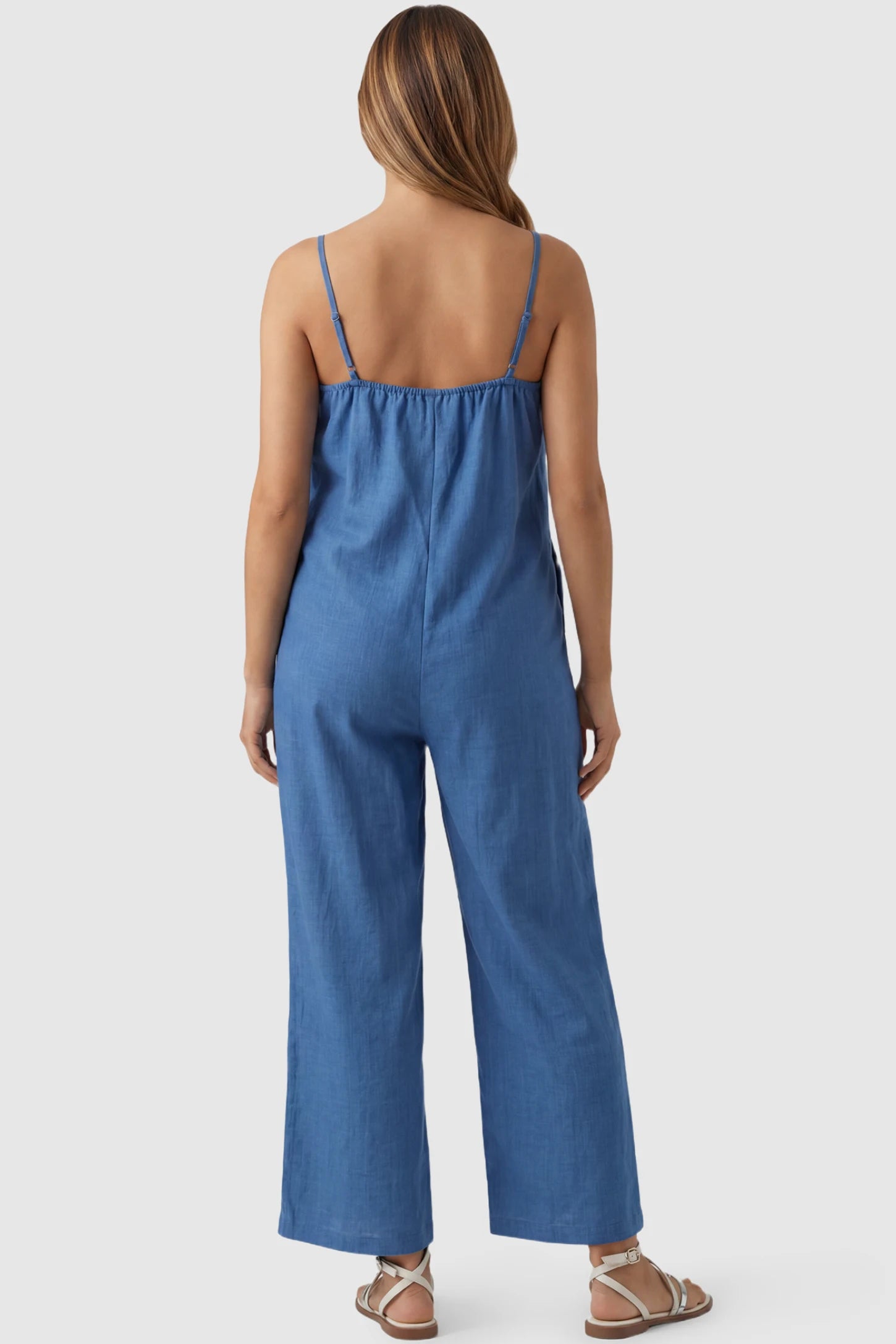 Wide‑Leg Scoop Neck Pocketed Maternity Jumpsuit Wide-leg scoop neck pocketed maternity jumpsuit in blue with sleeveless design, thin strap, and wide-leg silhouette, back view on pregnant model
