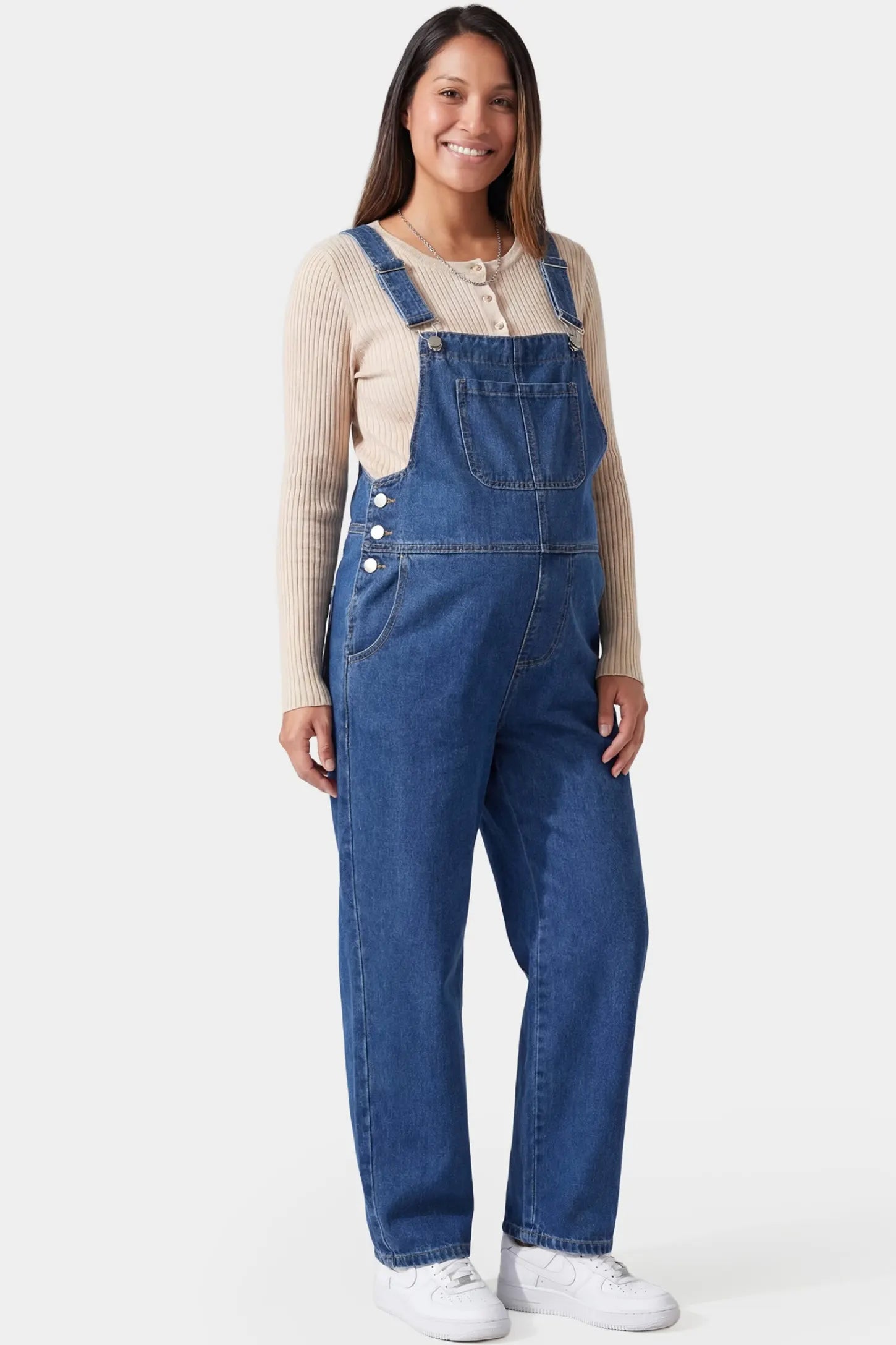 Wide Leg Relaxed Fit Maternity Overalls Wide leg relaxed fit maternity overalls in blue denim featuring adjustable straps on a pregnant model