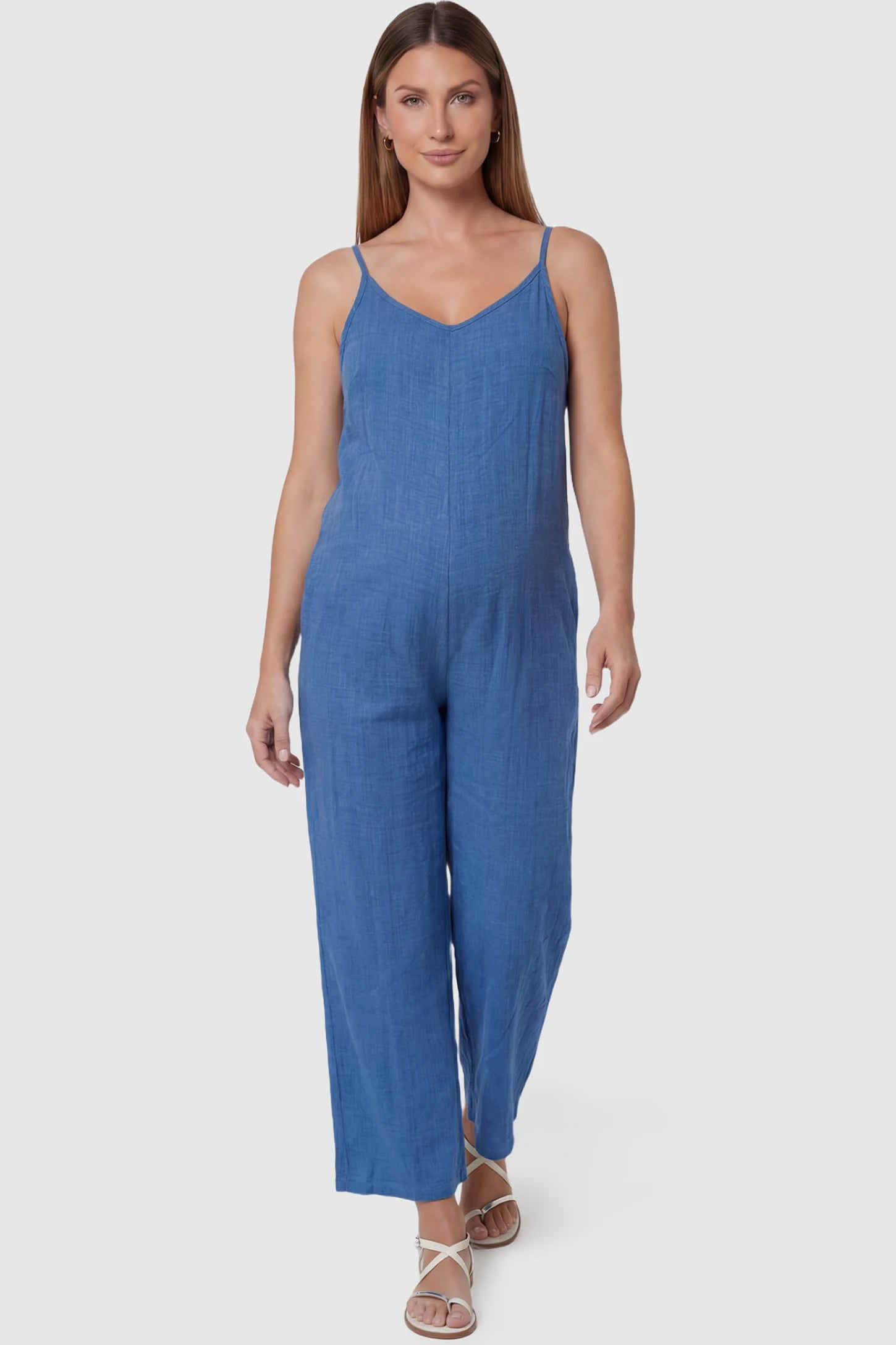 Wide‑Leg Scoop Neck Pocketed Maternity Jumpsuit Wide-leg scoop neck pocketed maternity jumpsuit in blue with sleeveless design, thin strap, and wide-leg silhouette, front view on pregnant model
