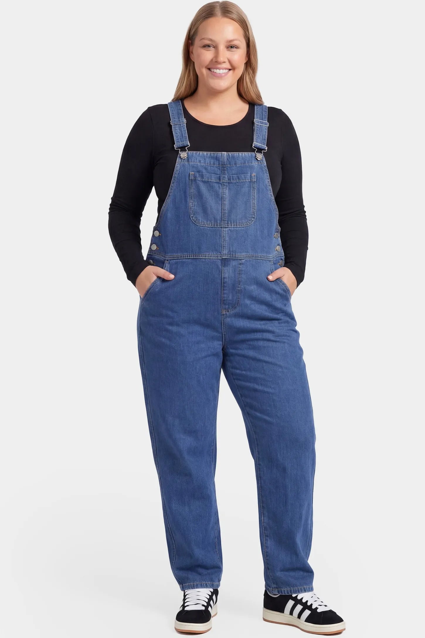 Wide Leg Relaxed Fit Maternity Overalls Wide leg relaxed fit maternity overalls in blue denim featuring adjustable straps on a pregnant model