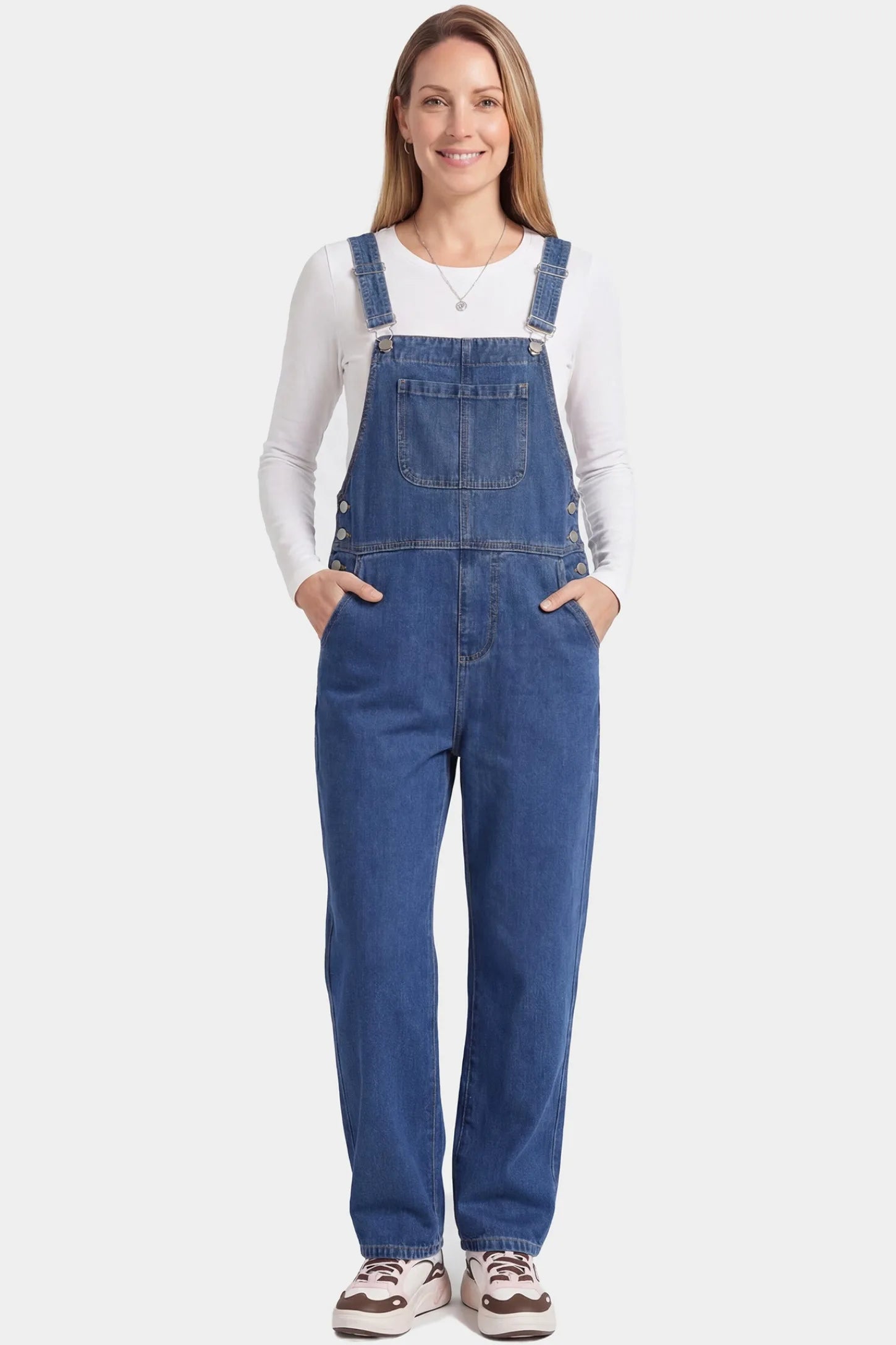 Wide Leg Relaxed Fit Maternity Overalls Wide leg relaxed fit maternity overalls in blue denim featuring adjustable straps on a pregnant model