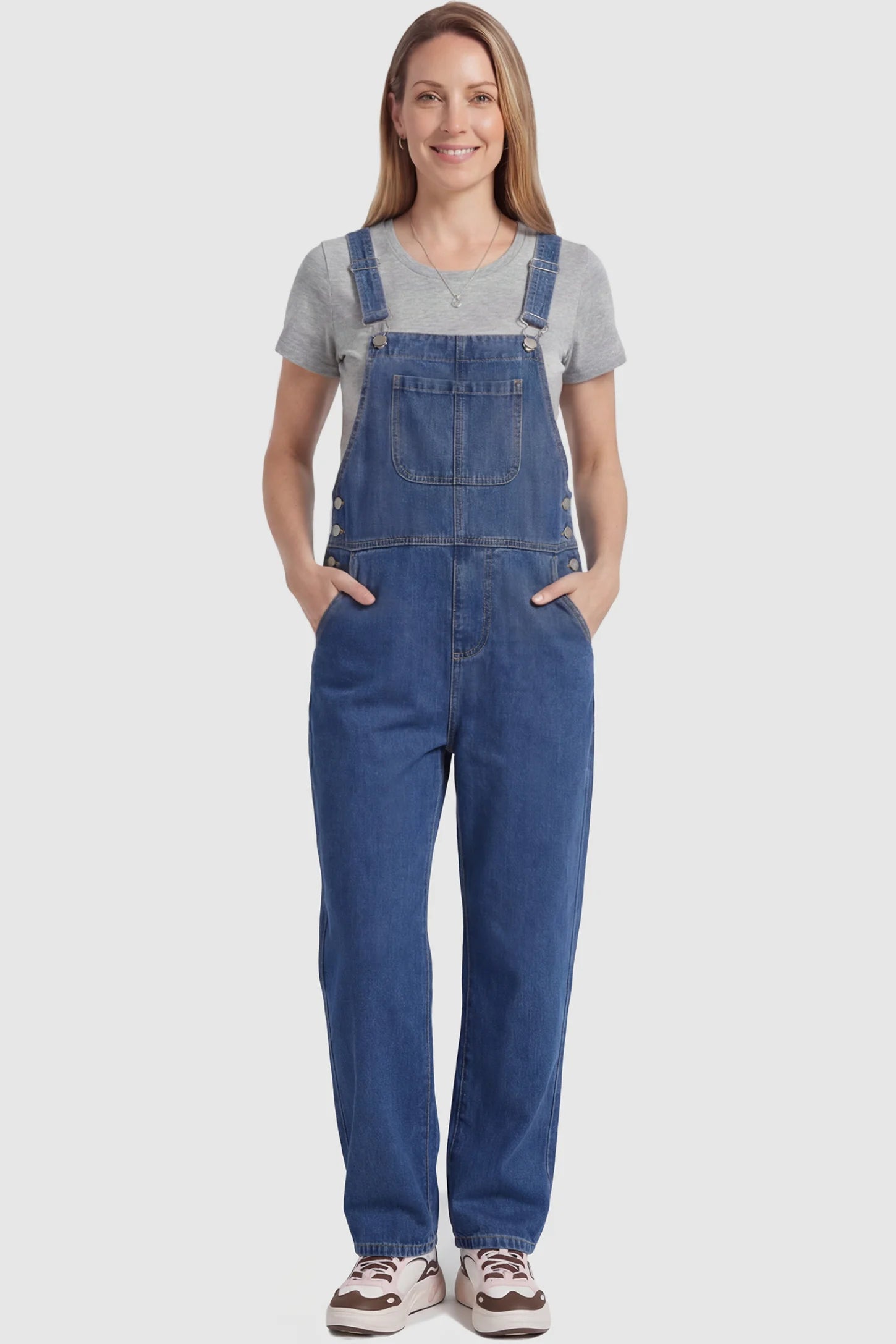 Wide Leg Relaxed Fit Maternity Overalls Wide leg relaxed fit maternity overalls in blue with adjustable straps and front pockets, front view on postpartum model