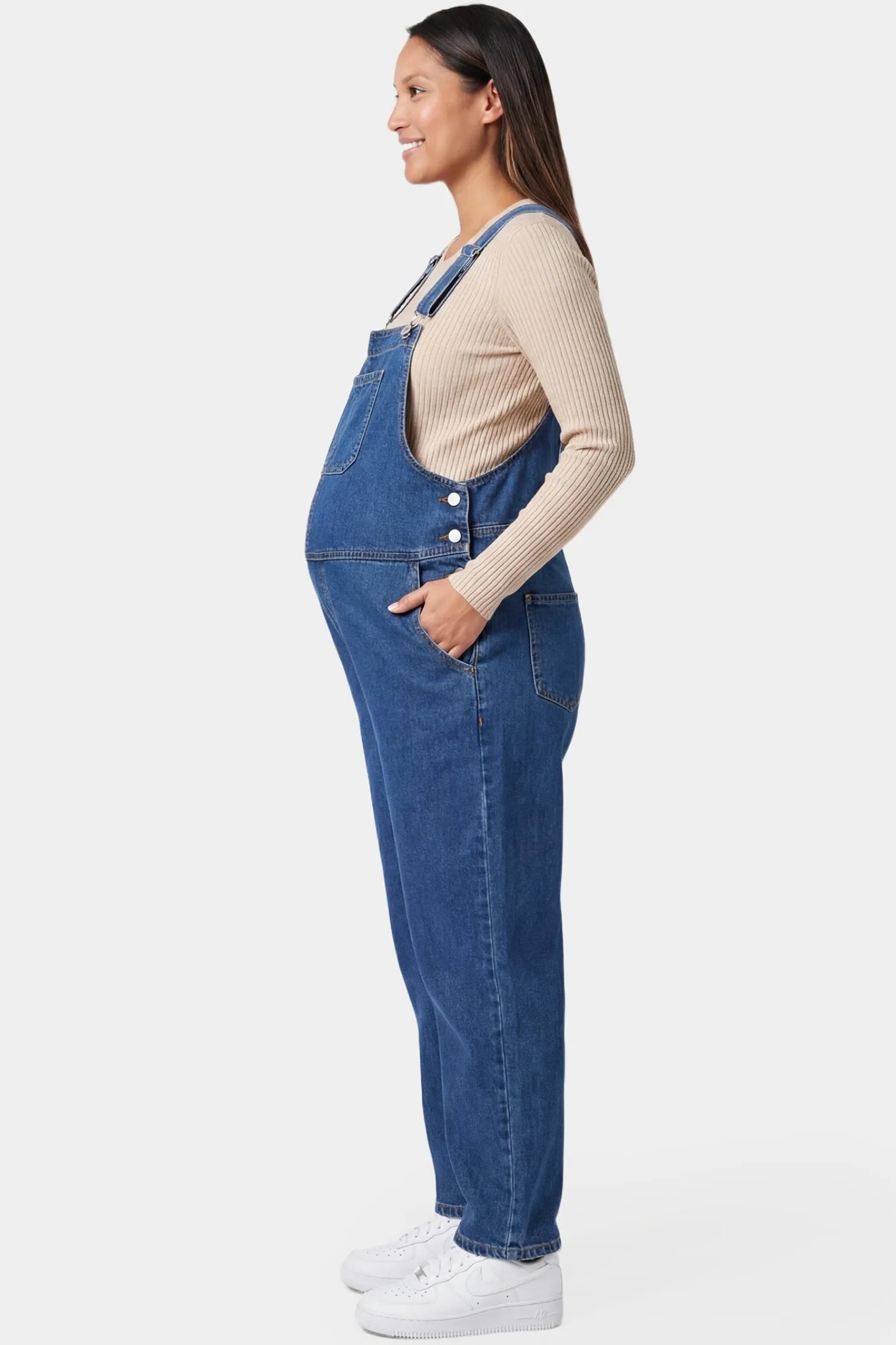 Wide Leg Relaxed Fit Maternity Overalls Wide leg relaxed fit maternity overalls in blue denim featuring adjustable straps on a pregnant model