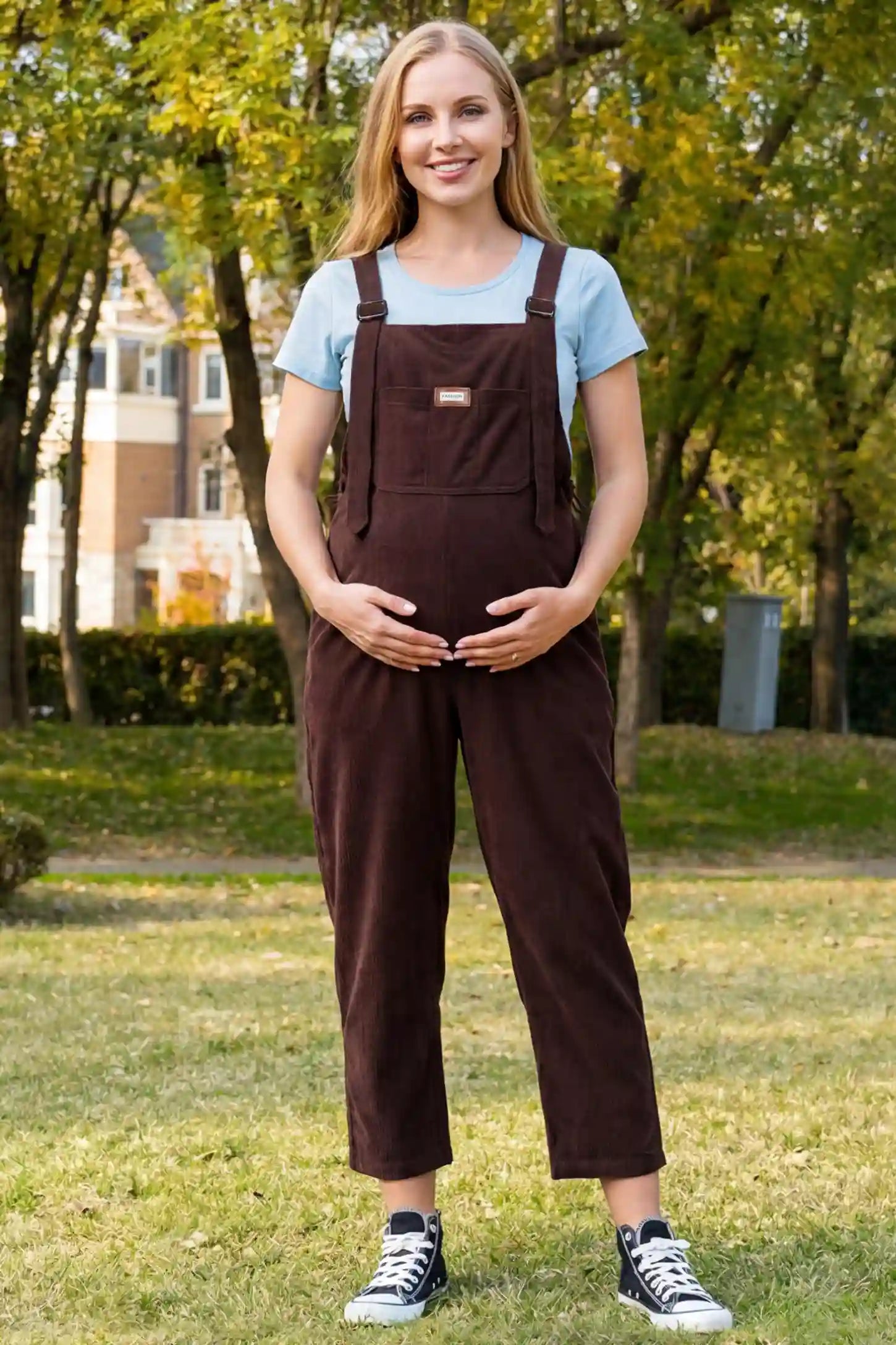 Wide Leg Side Stretch Panel Maternity Overalls Wide leg side stretch panel maternity overalls in brown with soft corduroy texture, front view on pregnant model