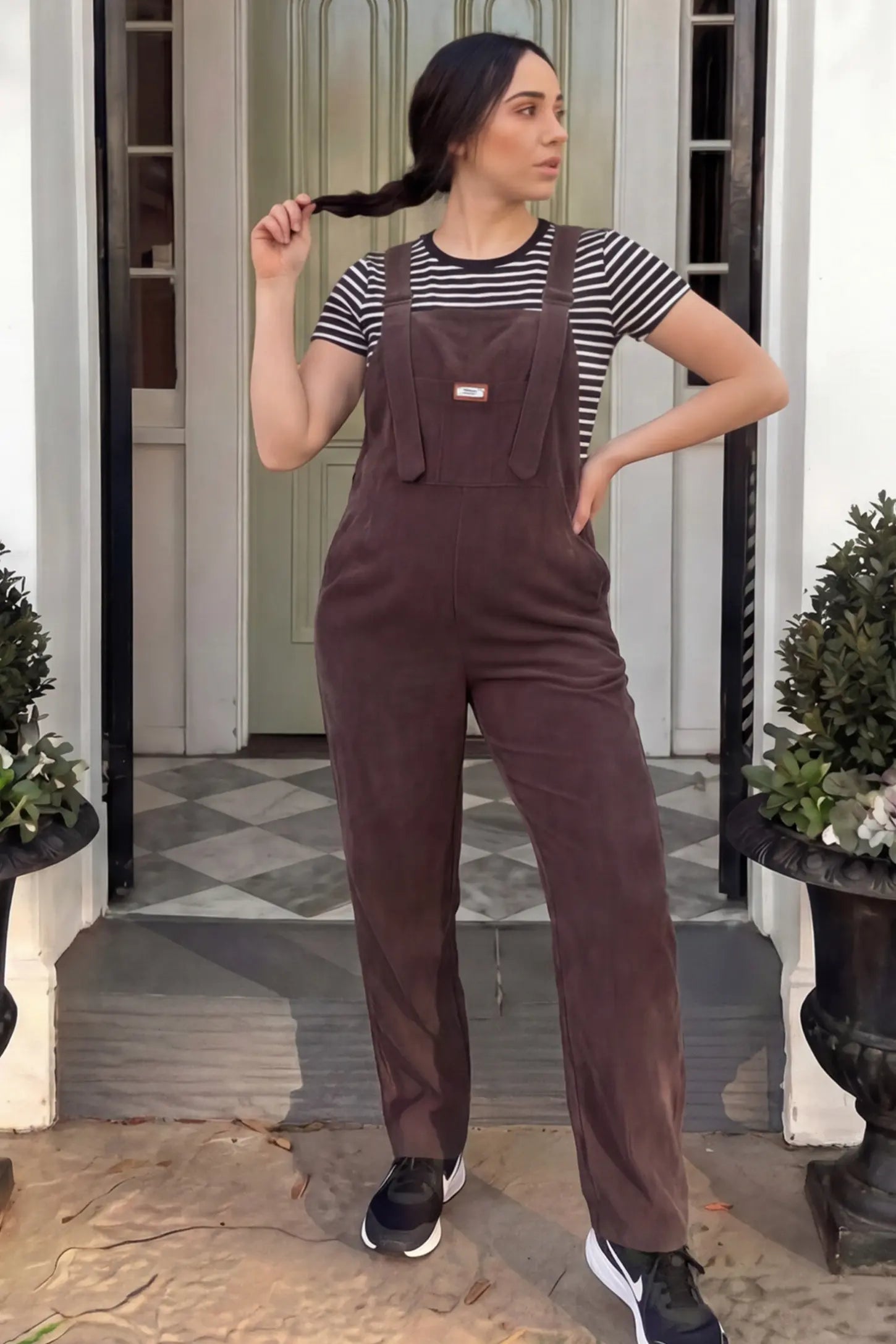 Wide Leg Side Stretch Panel Maternity Overalls Wide leg side stretch panel maternity overalls in brown featuring flexible side panels on a pregnant model