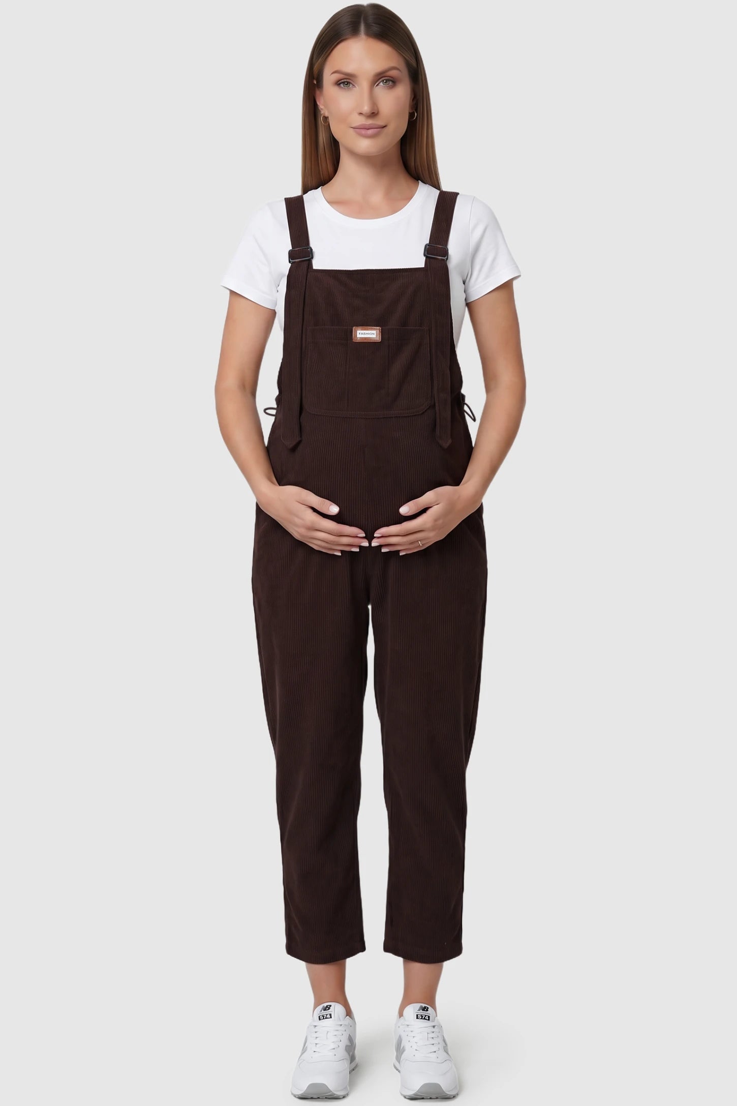 Wide Leg Side Stretch Panel Maternity Overalls Wide leg side stretch panel maternity overalls in brown with soft corduroy texture, front view on pregnant model