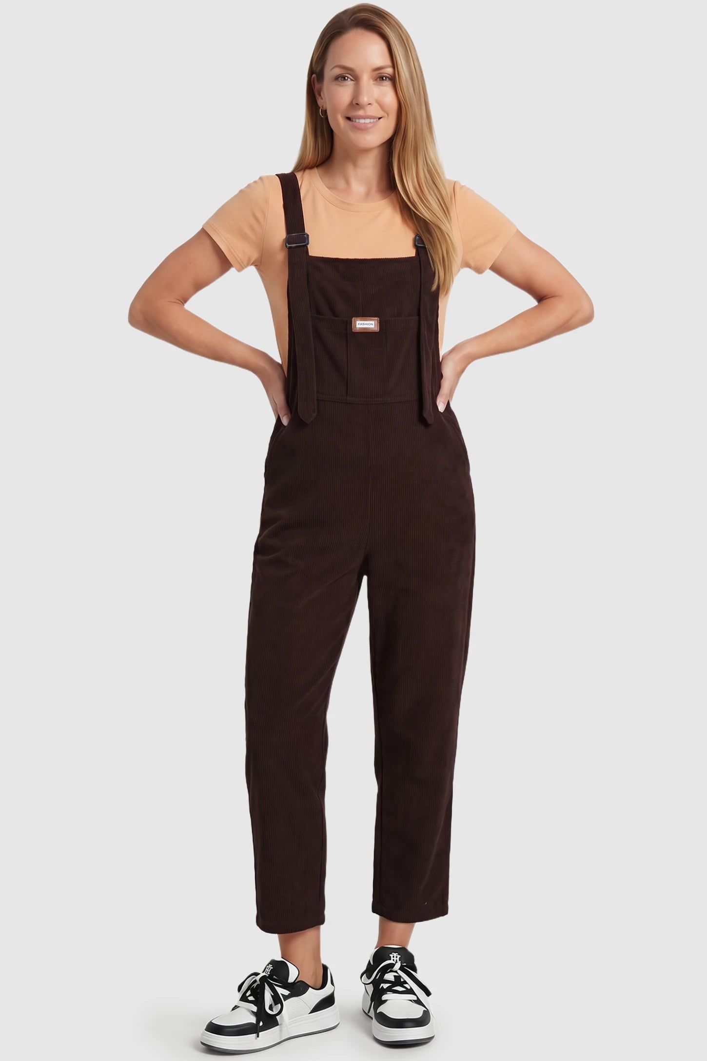 Wide Leg Side Stretch Panel Maternity Overalls Wide leg side stretch panel maternity overalls in brown with soft corduroy texture, front view on postpartum model