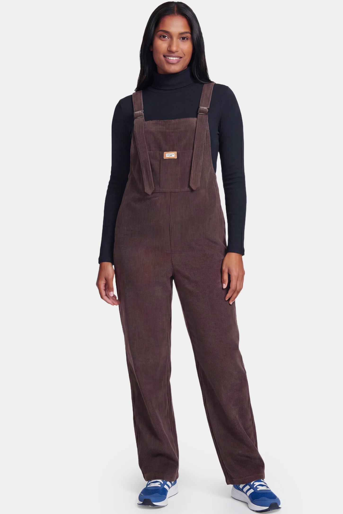 Wide Leg Side Stretch Panel Maternity Overalls Wide leg side stretch panel maternity overalls in brown featuring flexible side panels on a pregnant model