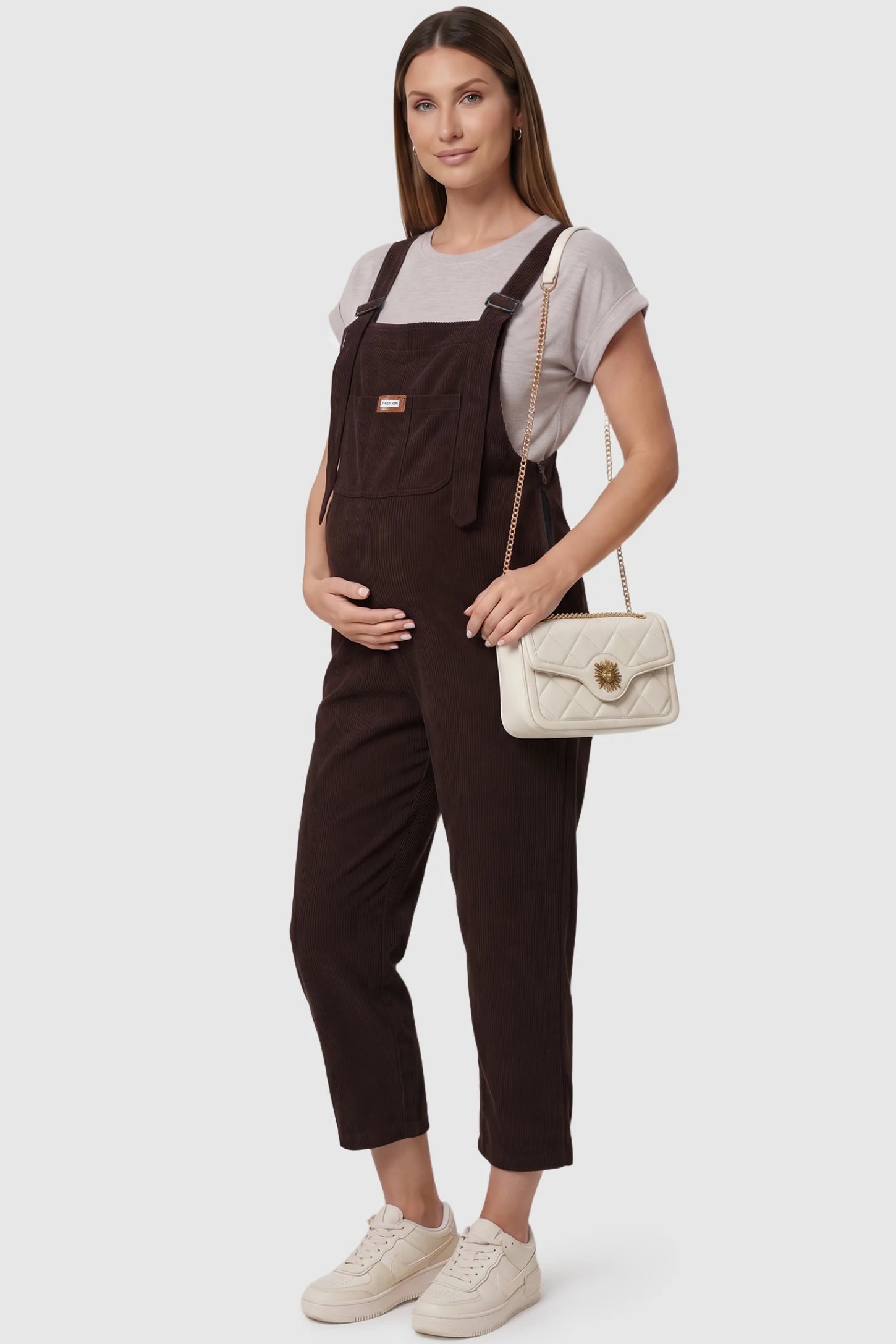 Wide Leg Side Stretch Panel Maternity Overalls Wide leg side stretch panel maternity overalls in brown with soft corduroy texture, front view on pregnant model