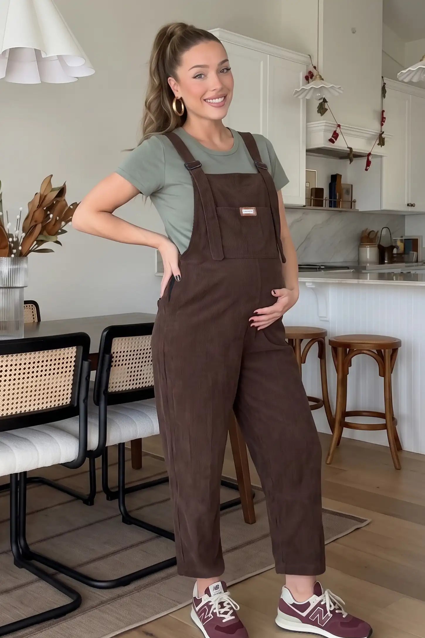 Wide Leg Side Stretch Panel Maternity Overalls Wide leg side stretch panel maternity overalls in brown with soft corduroy texture, front view on pregnant model