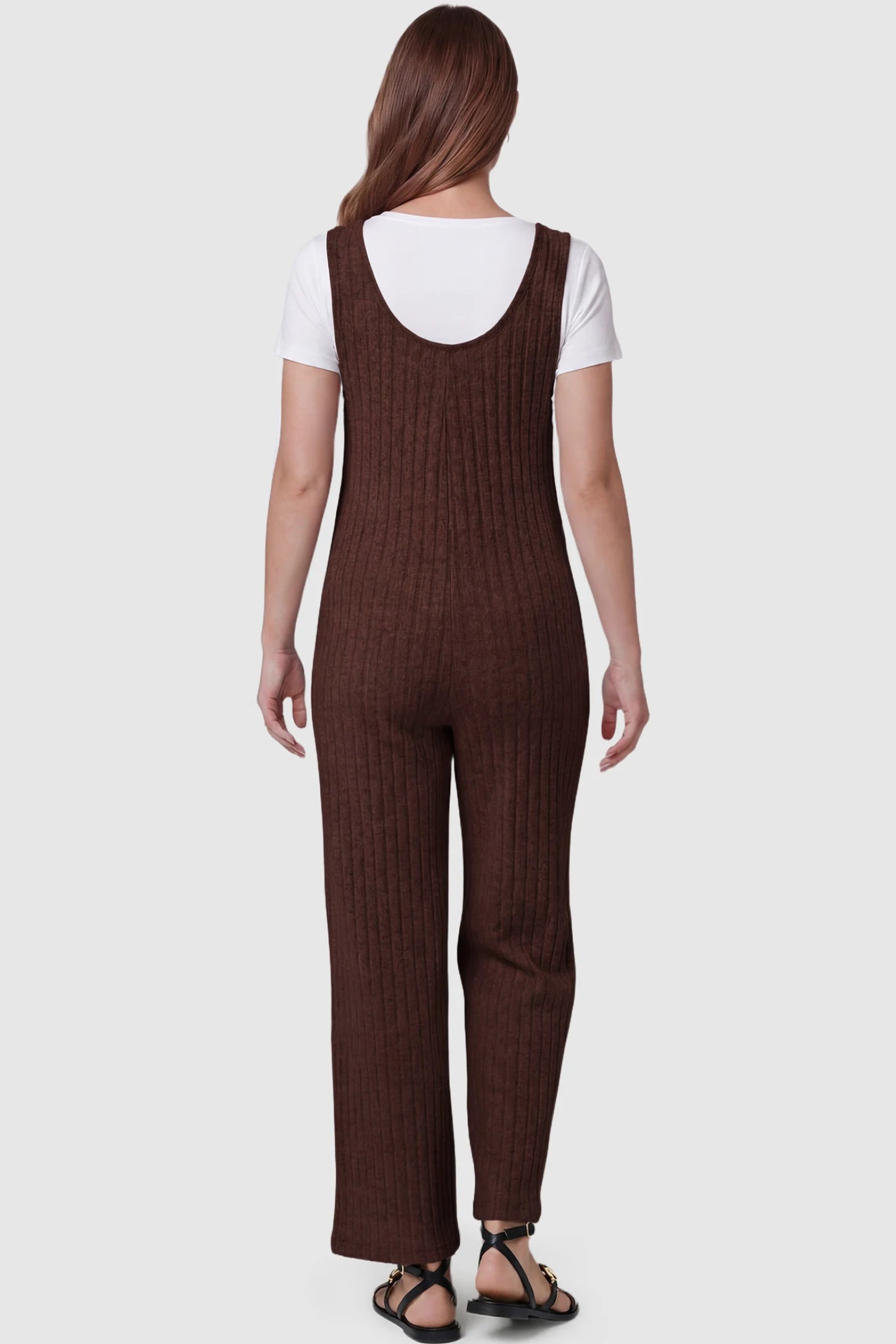 Ribbed Sleeveless Wide-Leg Maternity Jumpsuit Ribbed sleeveless wide-leg maternity jumpsuit in dark brown with sleeveless ribbed design, back view on pregnant model