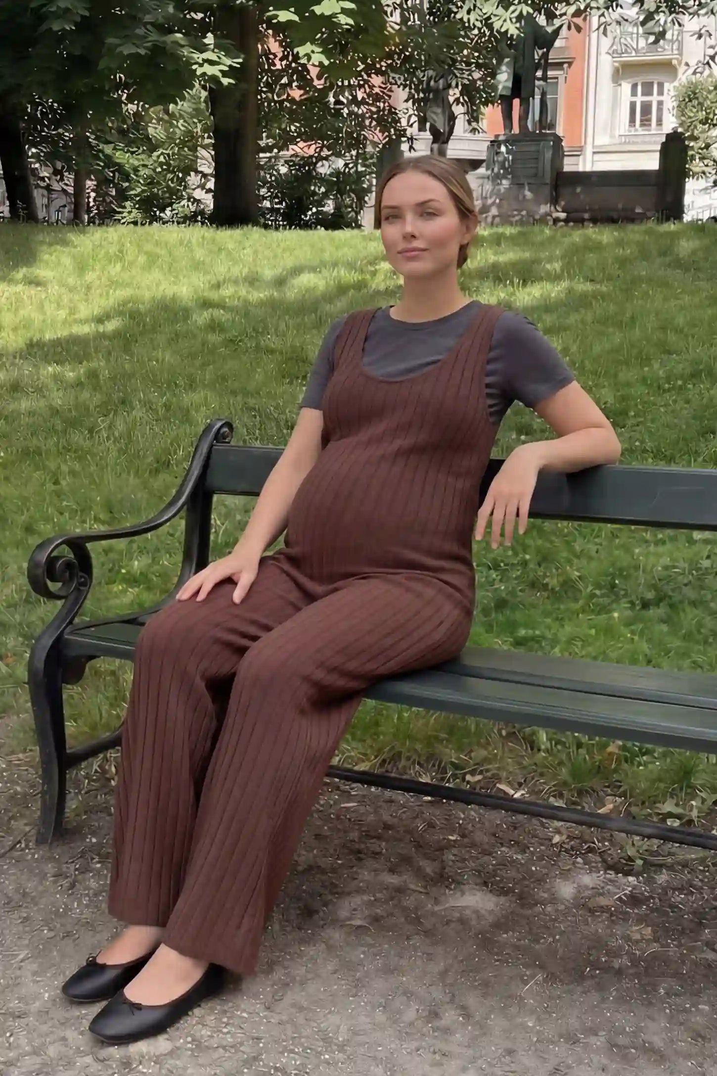 Ribbed Sleeveless Wide-Leg Maternity Jumpsuit Ribbed sleeveless wide-leg maternity jumpsuit in dark brown with sleeveless ribbed design, front view on pregnant model