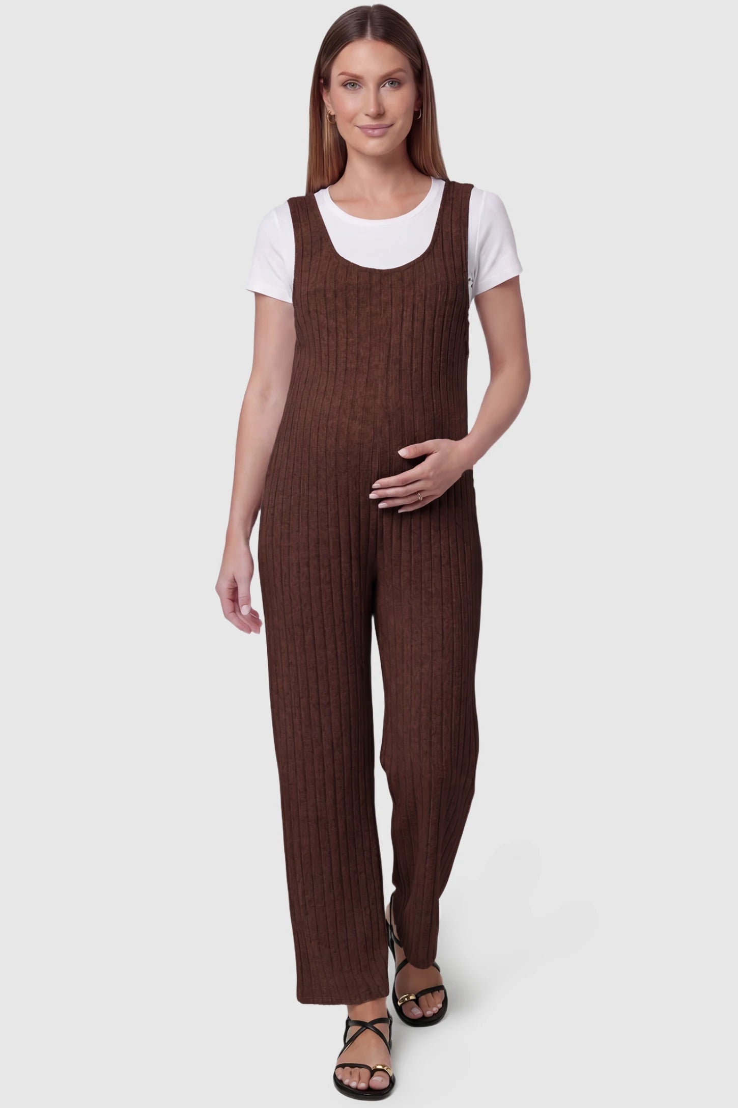 Ribbed Sleeveless Wide-Leg Maternity Jumpsuit Ribbed sleeveless wide-leg maternity jumpsuit in dark brown with sleeveless ribbed design, front view on pregnant model