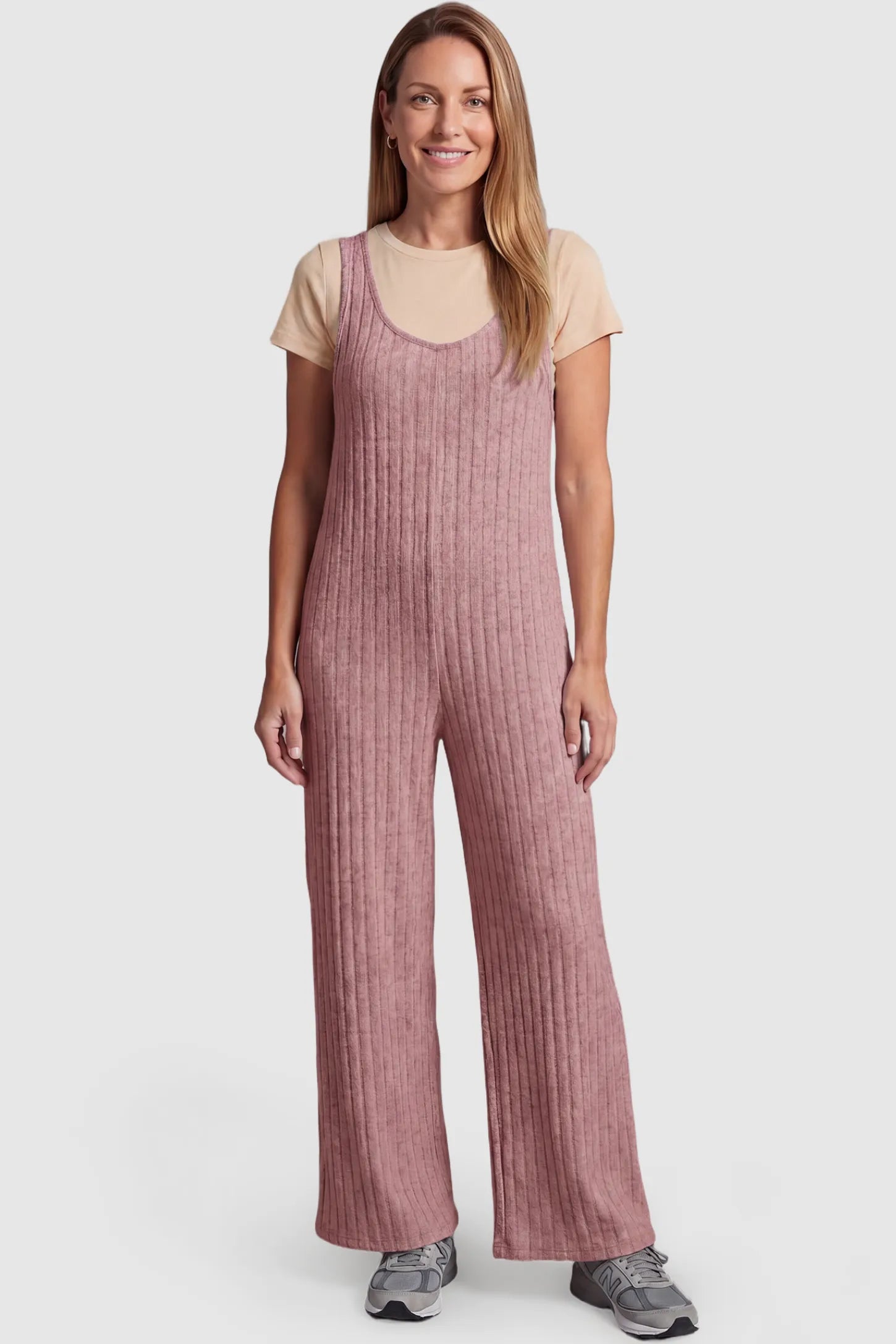 Ribbed Sleeveless Wide-Leg Maternity Jumpsuit Ribbed sleeveless wide-leg maternity jumpsuit in dark pink with sleeveless ribbed design, front view on postpartum model