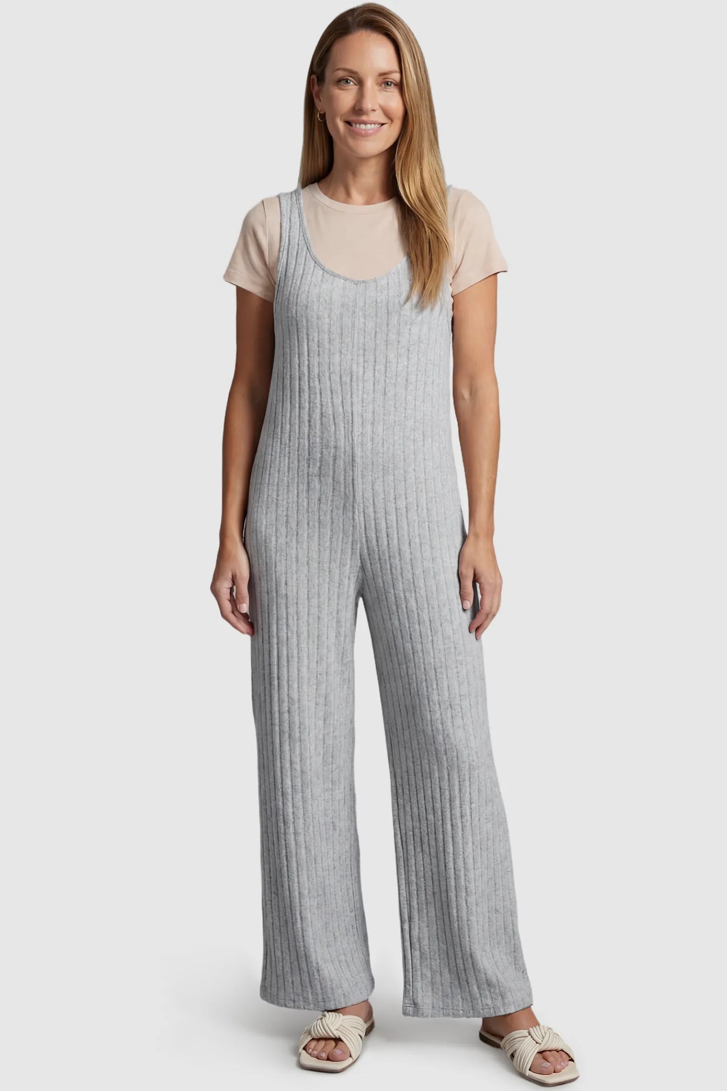 Ribbed Sleeveless Wide-Leg Maternity Jumpsuit Ribbed sleeveless wide-leg maternity jumpsuit in gray with sleeveless ribbed design, front view on postpartum model