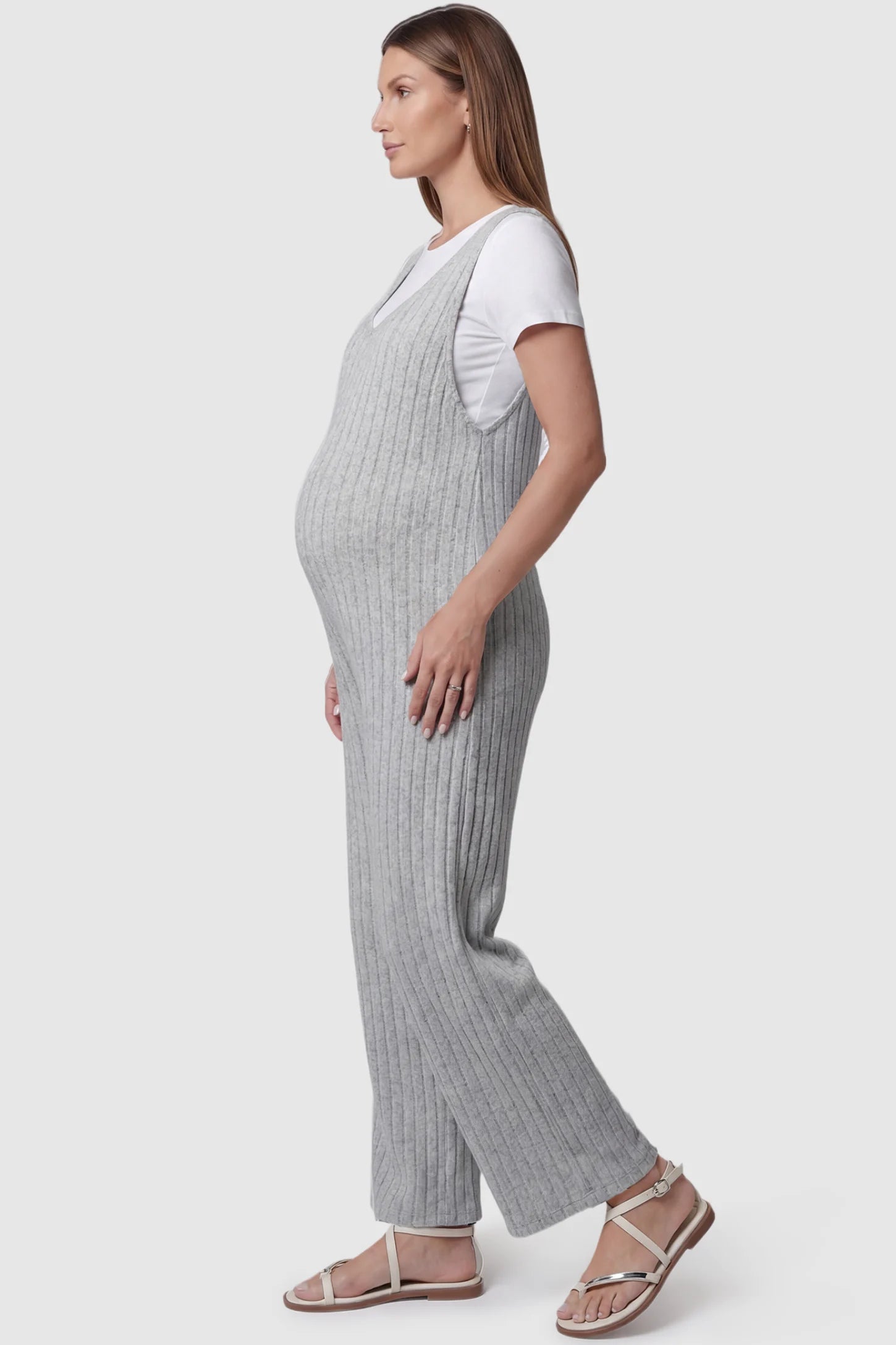 Ribbed Sleeveless Wide-Leg Maternity Jumpsuit Ribbed sleeveless wide-leg maternity jumpsuit in gray with sleeveless ribbed design, side view on pregnant model