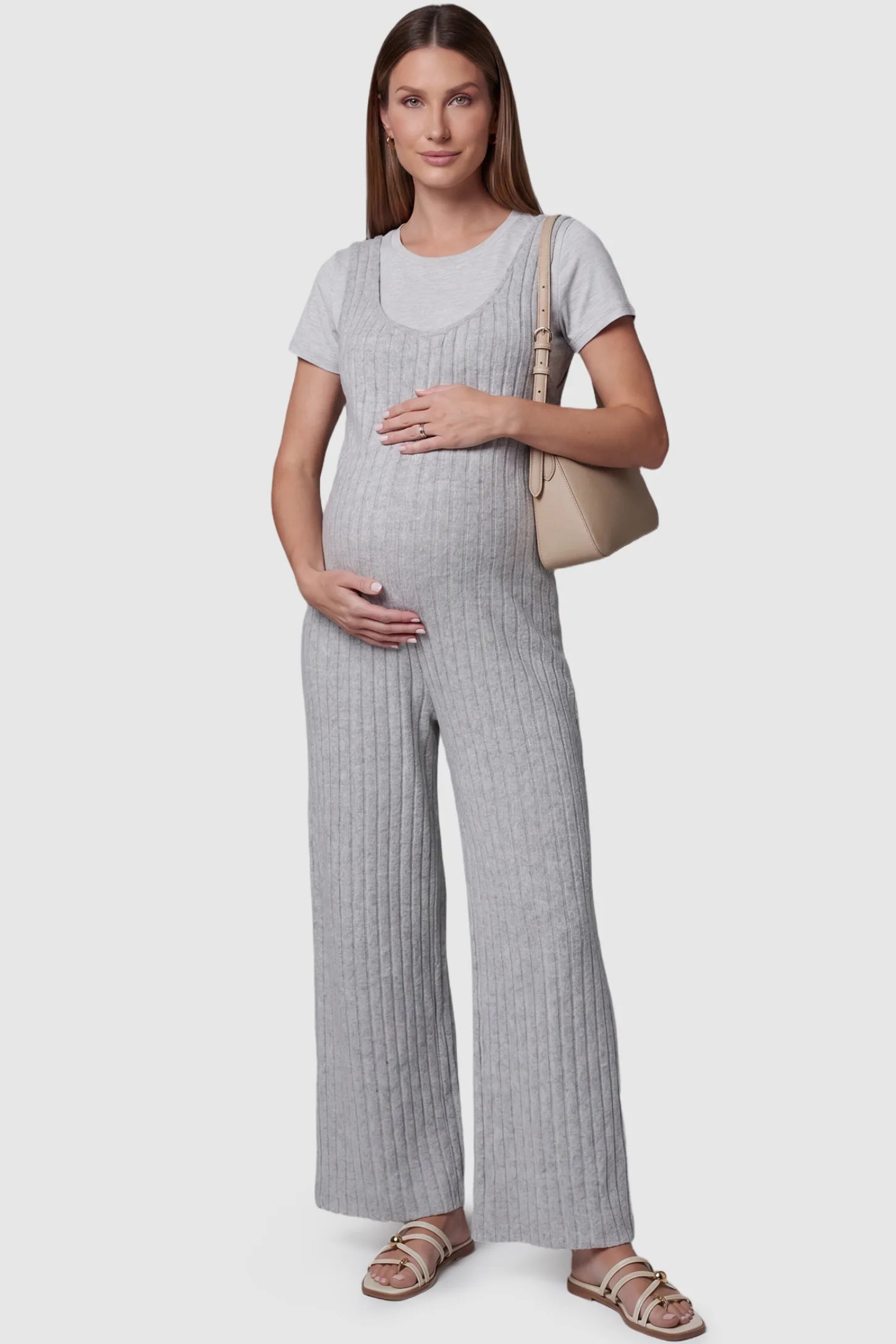 Ribbed Sleeveless Wide-Leg Maternity Jumpsuit Ribbed sleeveless wide-leg maternity jumpsuit in gray with sleeveless ribbed design, front view on pregnant model