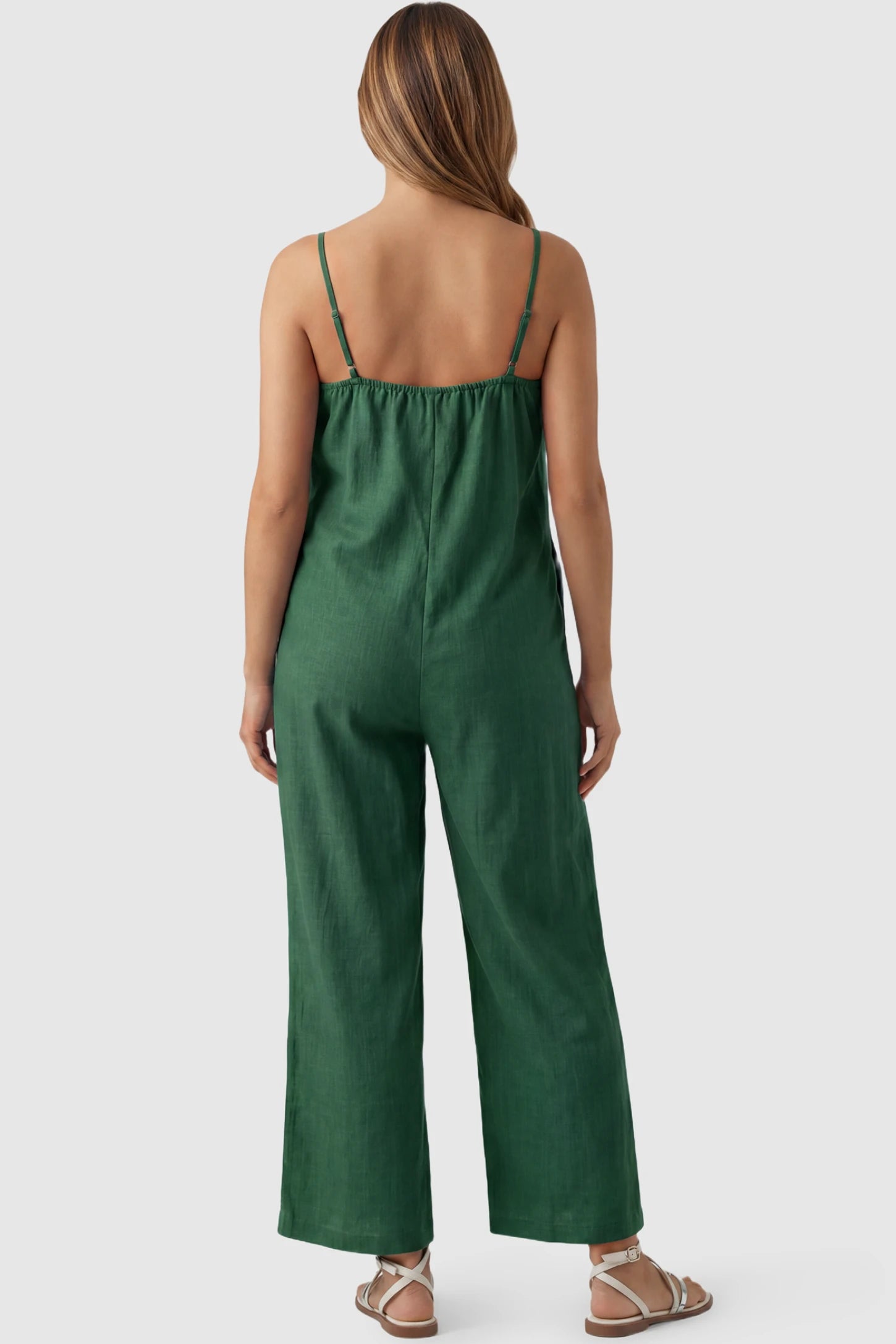 Wide‑Leg Scoop Neck Pocketed Maternity Jumpsuit Wide-leg scoop neck pocketed maternity jumpsuit in green with sleeveless design, thin strap, and wide-leg silhouette, back view on pregnant model