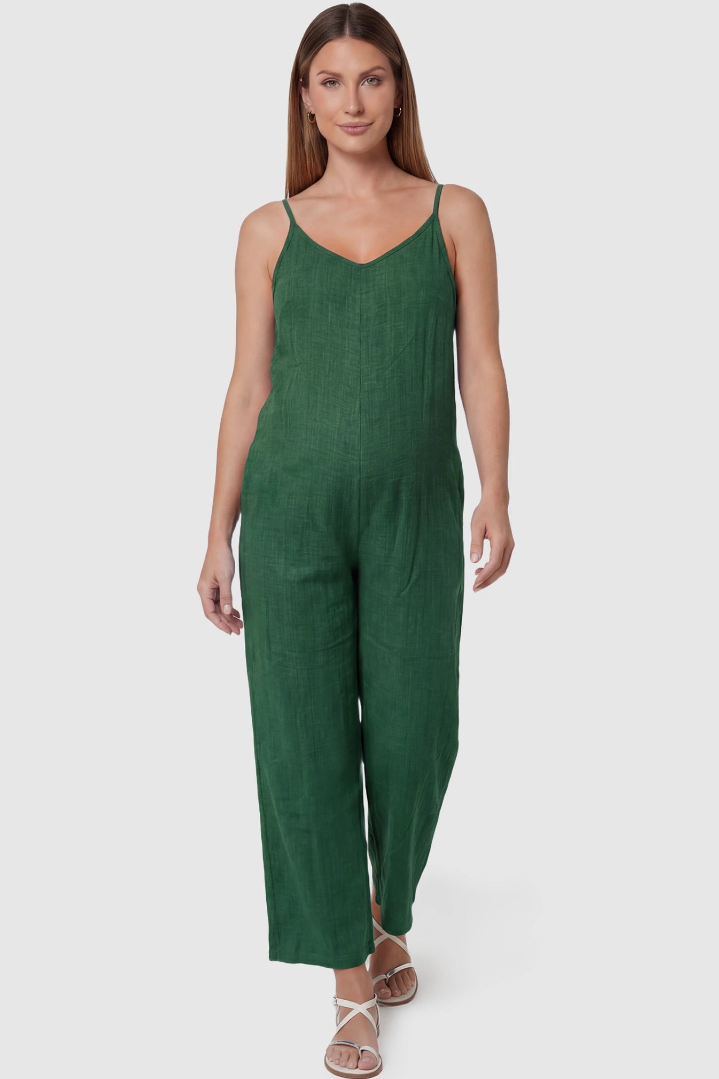 Wide‑Leg Scoop Neck Pocketed Maternity Jumpsuit Wide-leg scoop neck pocketed maternity jumpsuit in green with sleeveless design, thin strap, and wide-leg silhouette, front view on pregnant model