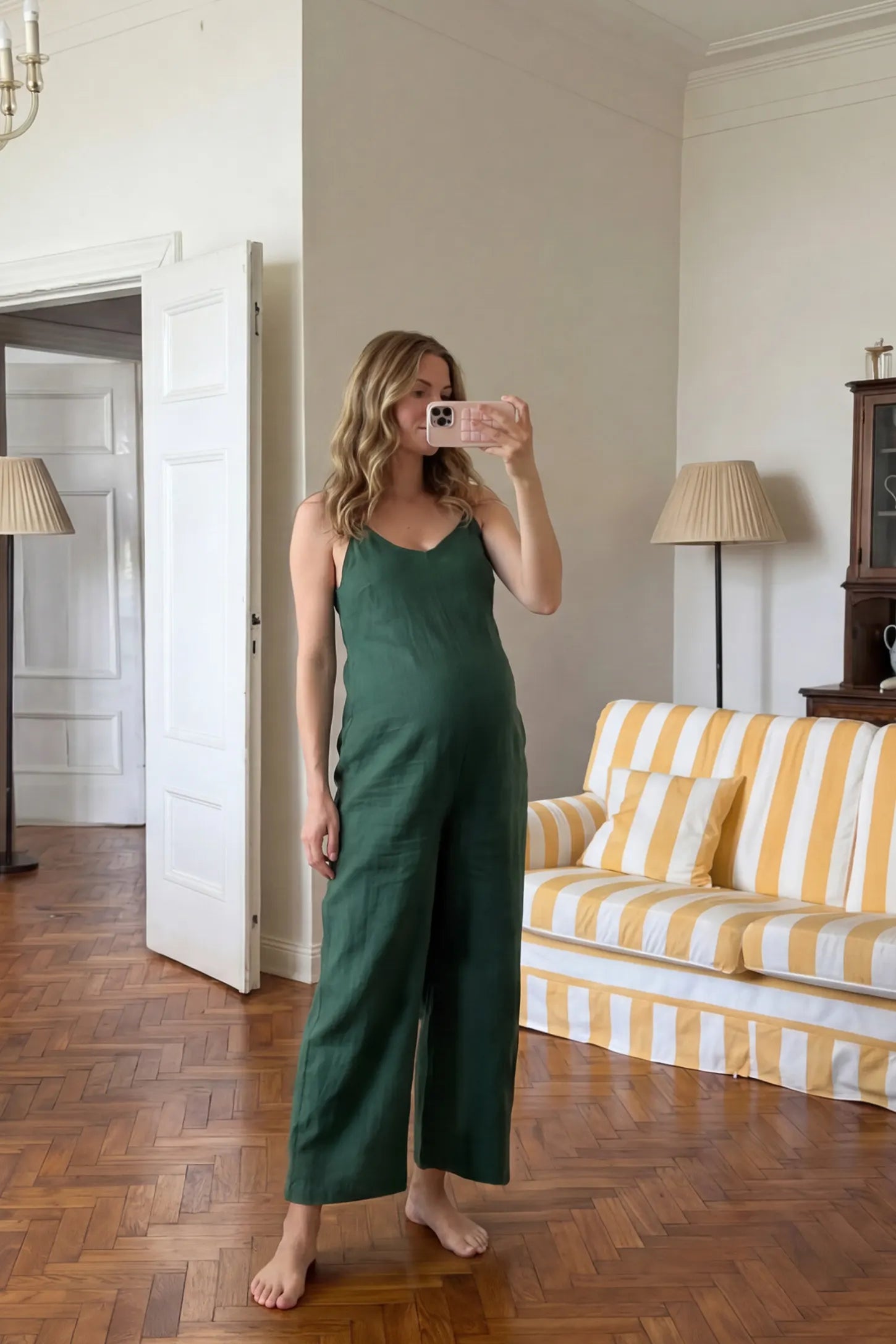 Wide‑Leg Scoop Neck Pocketed Maternity Jumpsuit Wide-leg scoop neck pocketed maternity jumpsuit in green with sleeveless design, thin strap, and wide-leg silhouette, UGC model