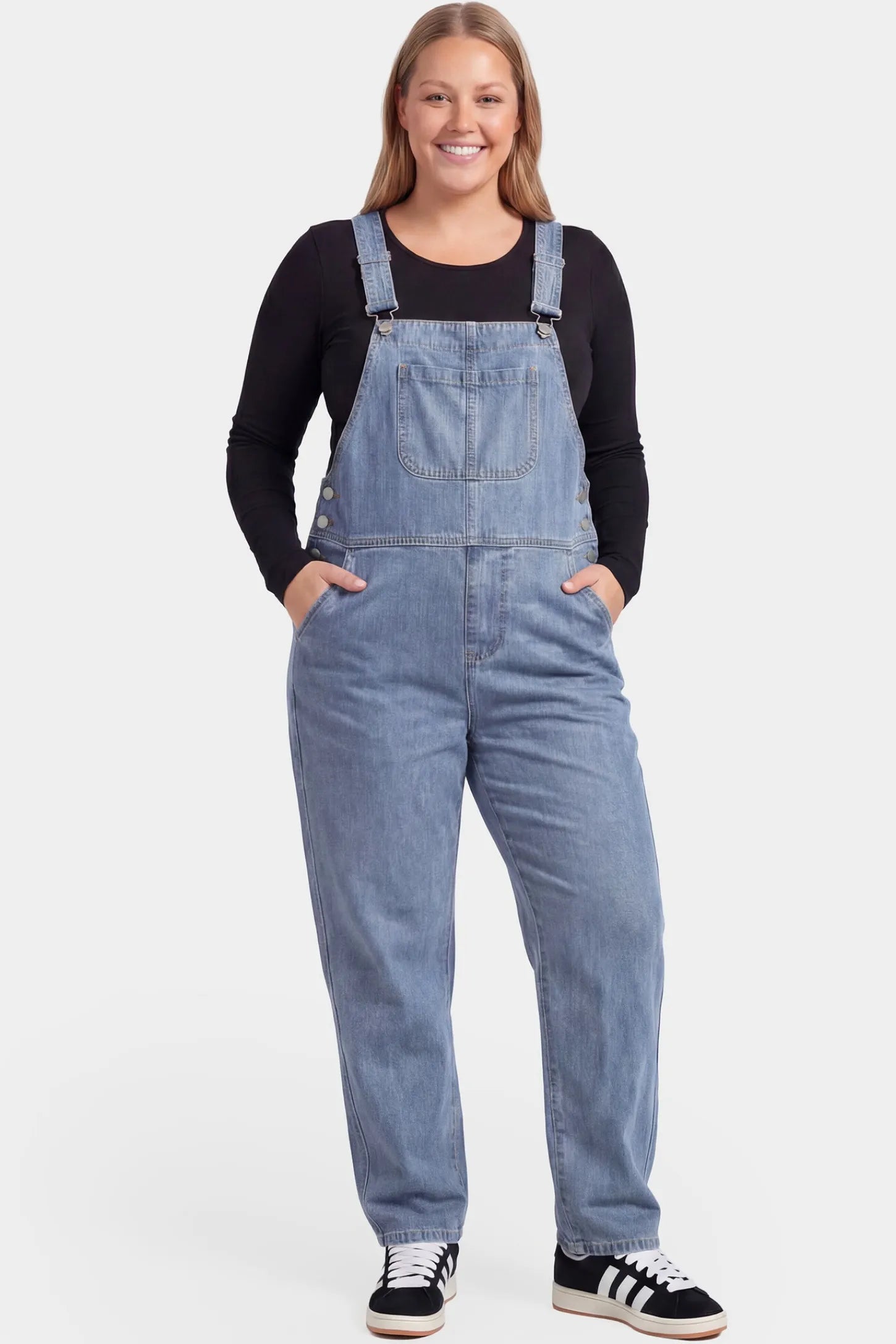 Wide Leg Relaxed Fit Maternity Overalls Wide leg relaxed fit maternity overalls in light blue denim featuring adjustable straps on a pregnant model