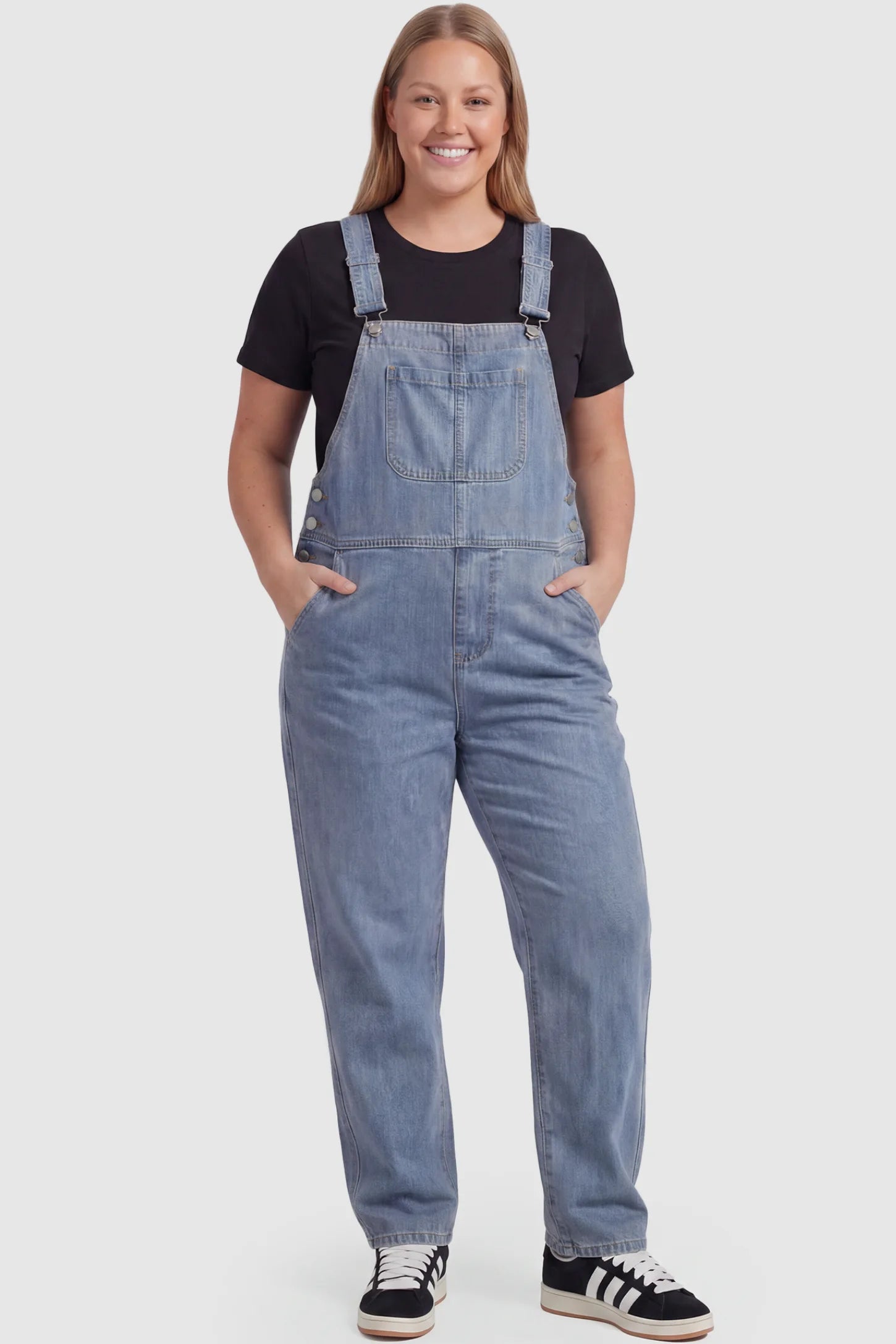 Wide Leg Relaxed Fit Maternity Overalls Wide leg relaxed fit maternity overalls in light blue with adjustable straps and front pockets, front view on plus-size model