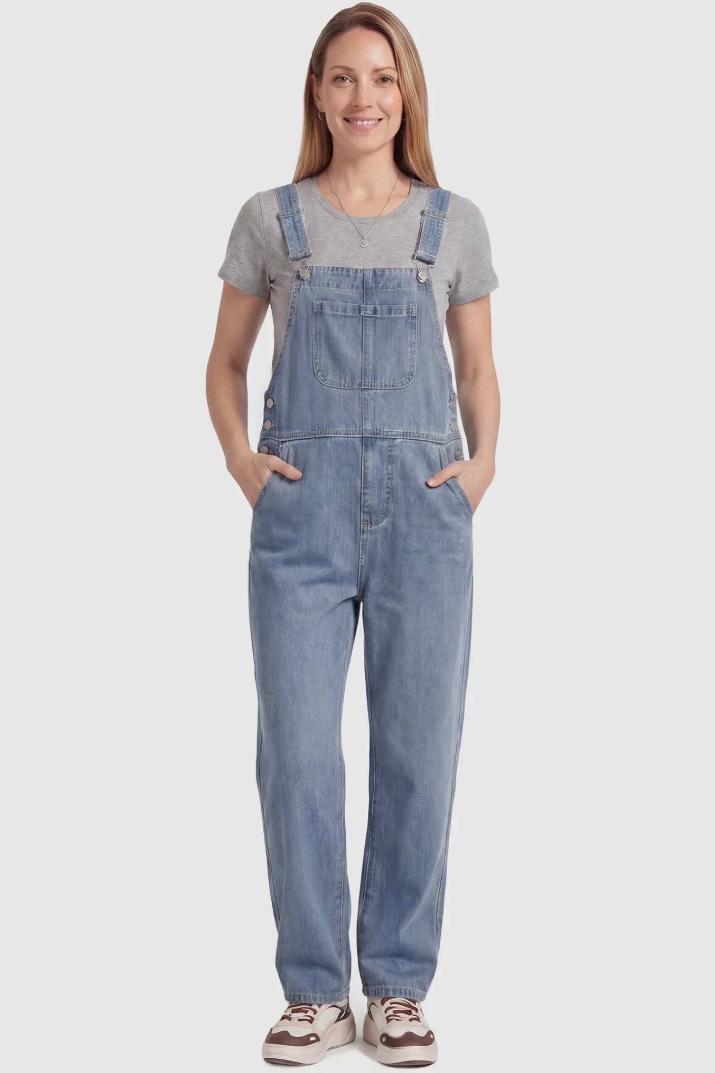 Wide Leg Relaxed Fit Maternity Overalls Wide leg relaxed fit maternity overalls in light blue with adjustable straps and front pockets, front view on postpartum model