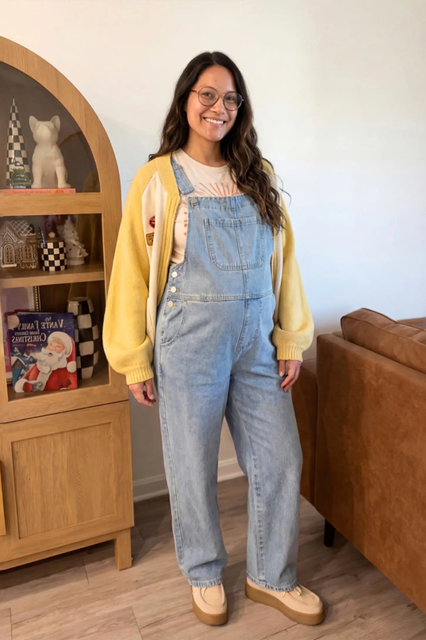 Wide Leg Relaxed Fit Maternity Overalls Wide leg relaxed fit maternity overalls in light blue denim featuring adjustable straps on a pregnant model