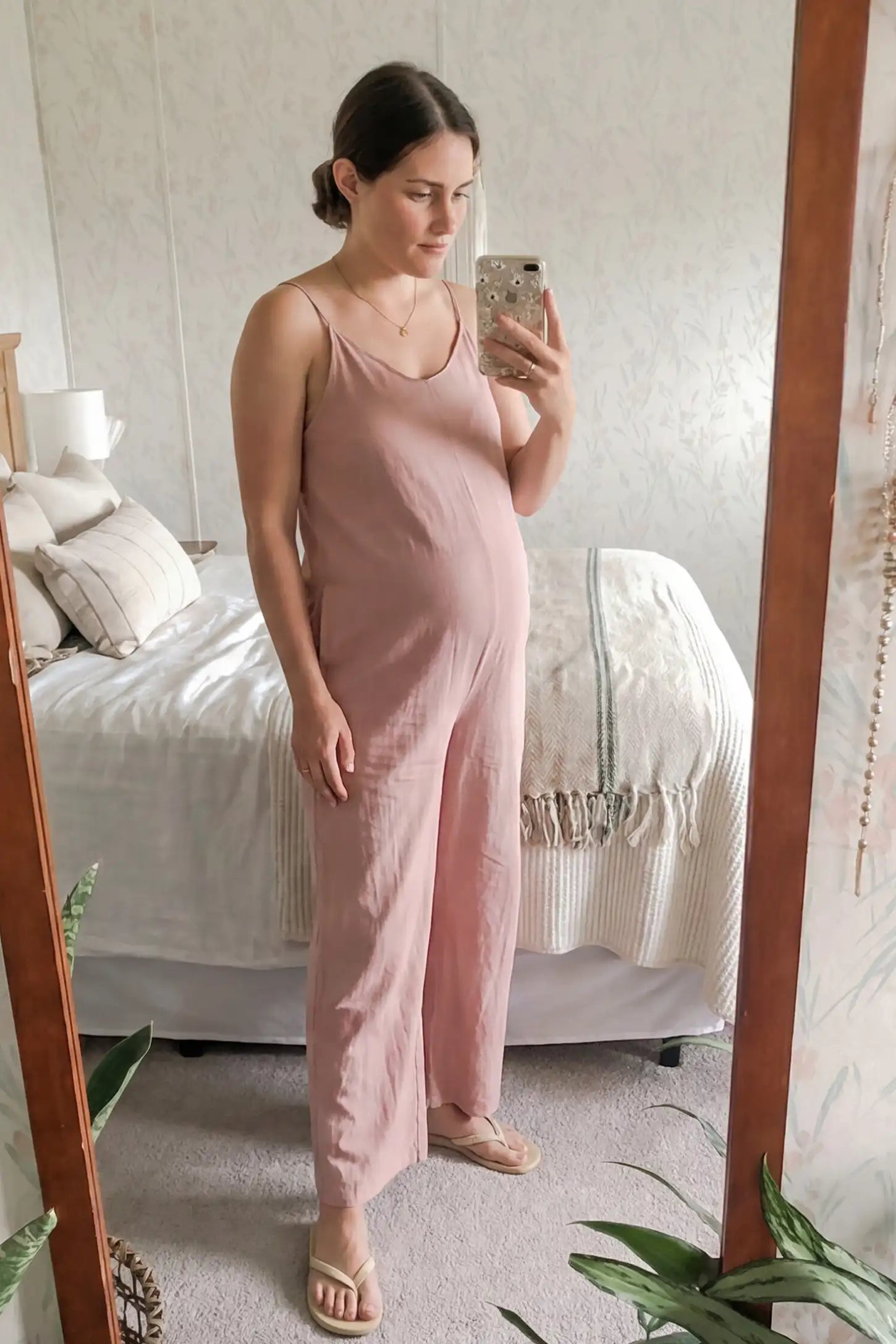 Wide‑Leg Scoop Neck Pocketed Maternity Jumpsuit Wide-leg scoop neck pocketed maternity jumpsuit in pink with sleeveless design, thin strap, and wide-leg silhouette, UGC model
